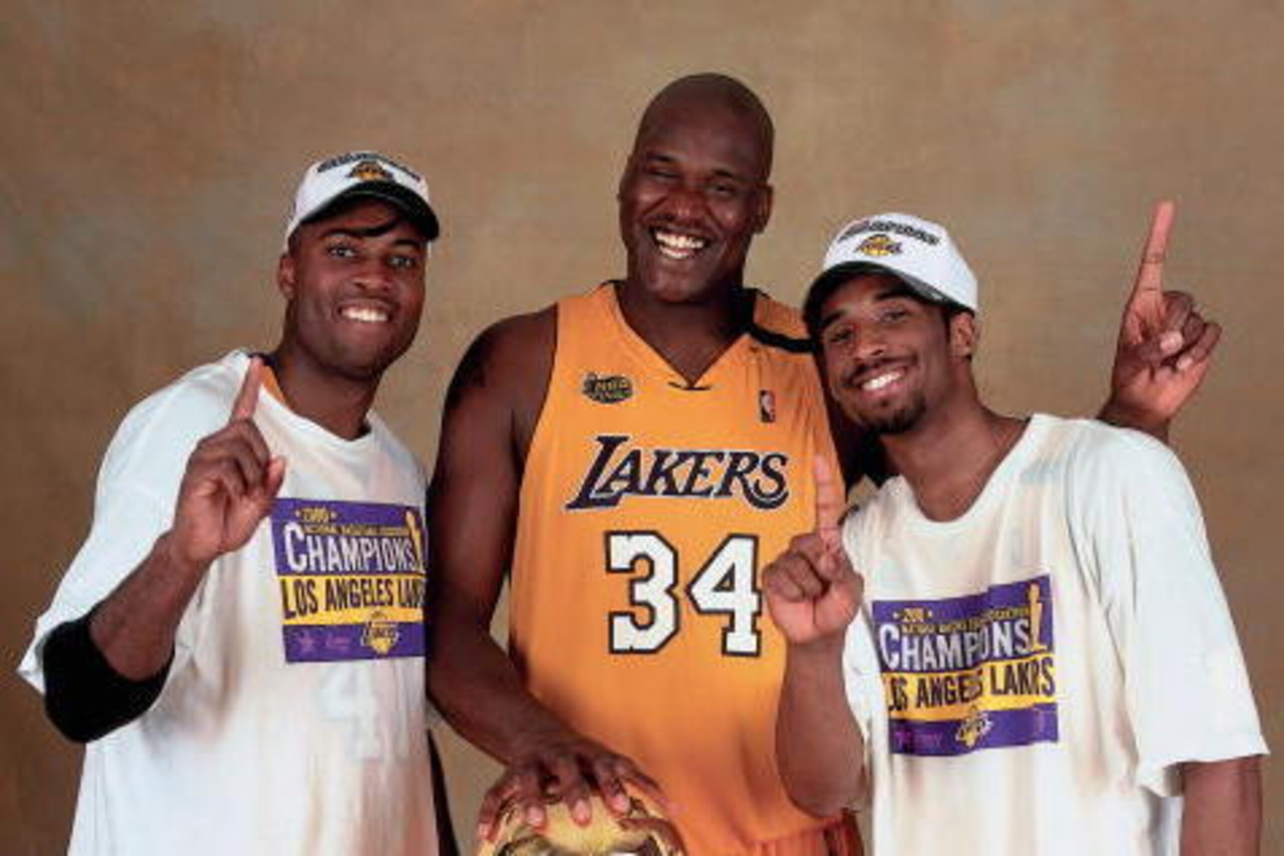 LOS ANGELES - JUNE 19:  Shaquille O'Neal #34, Kobe Bryant #8, and Glen Rice #41 of the Los Angeles Lakers pose for a photo after winning the NBA Championship on June 19, 2000 at the Staples Center in Los Angeles, California.  NOTE TO USER: User expressly 