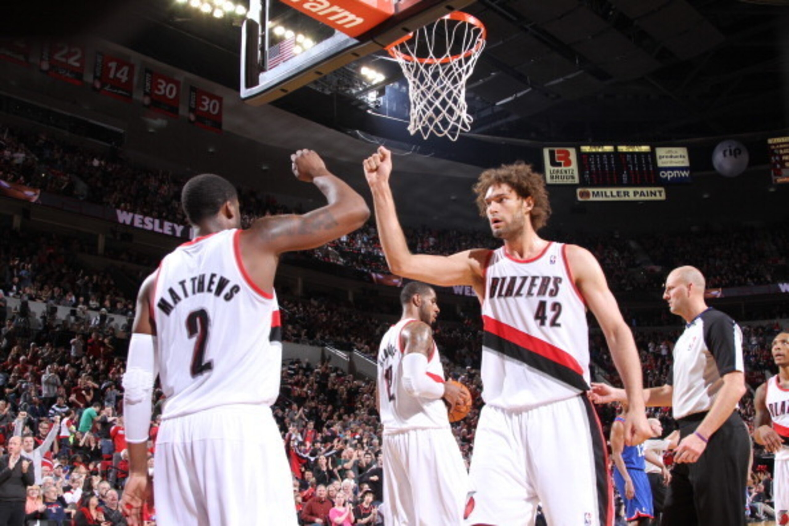 PORTLAND, OR - JANUARY 4:  Wesley Matthews #2 and Robin Lopez #42 of the Portland Trail Blazers celebrate against the Philadelphia 76ers on January 4, 2014 at the Moda Center Arena in Portland, Oregon. NOTE TO USER: User expressly acknowledges and agrees 