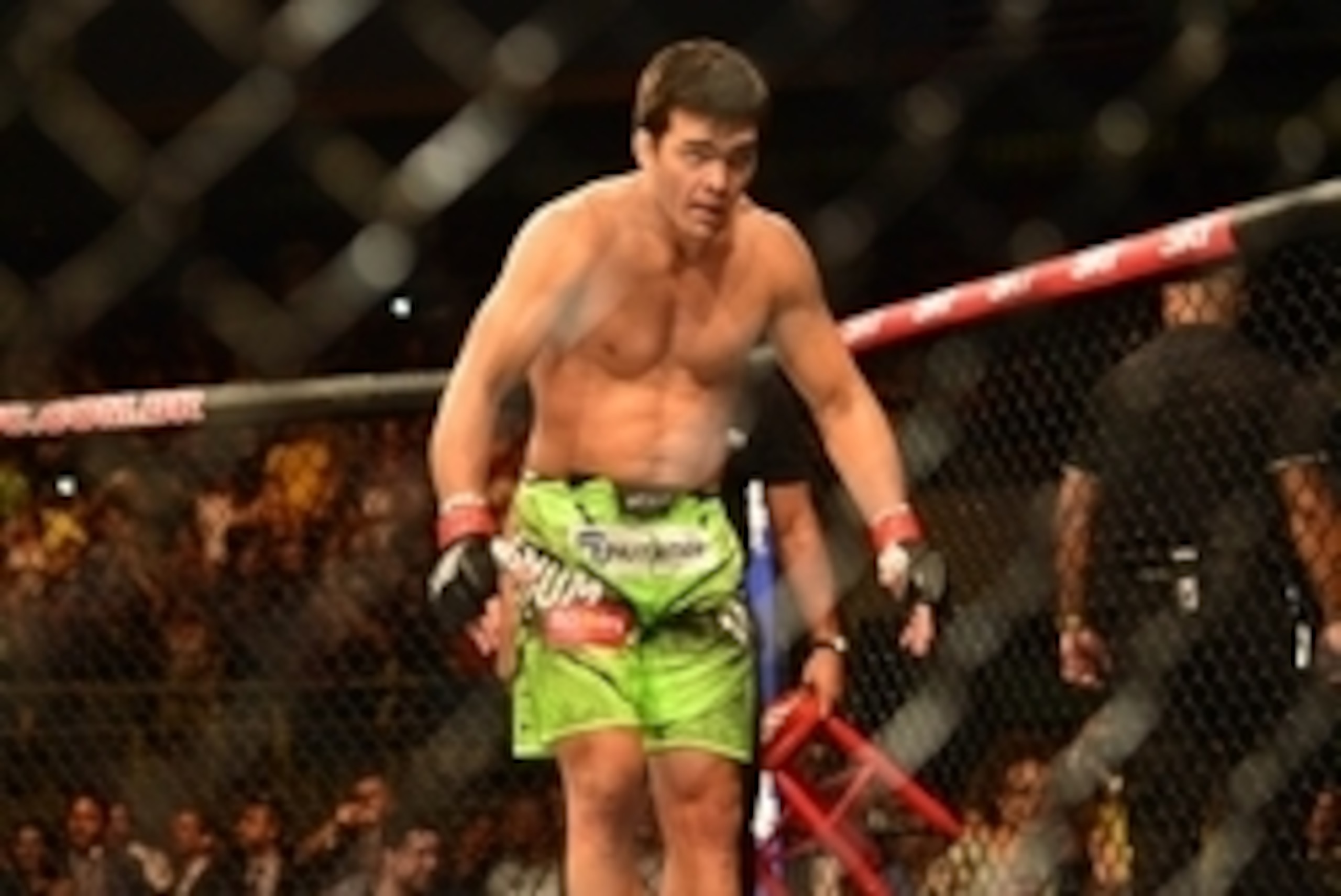 Dec 20, 2014; Barueri, SP, Brazil; Lyoto Machida (red gloves) celebrates after defeating C.B. Dollaway (blue gloves) during UFC Fight Night at Jose Correa Arena. Mandatory Credit: Jason Silva-USA TODAY Sports