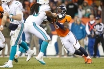 Nov 23, 2014; Denver, CO, USA; Denver Broncos outside linebacker Lerentee McCray (55) rushes against Miami Dolphins guard Dallas Thomas (63) during the game at Sports Authority Field at Mile High. Mandatory Credit: Chris Humphreys-USA TODAY Sports