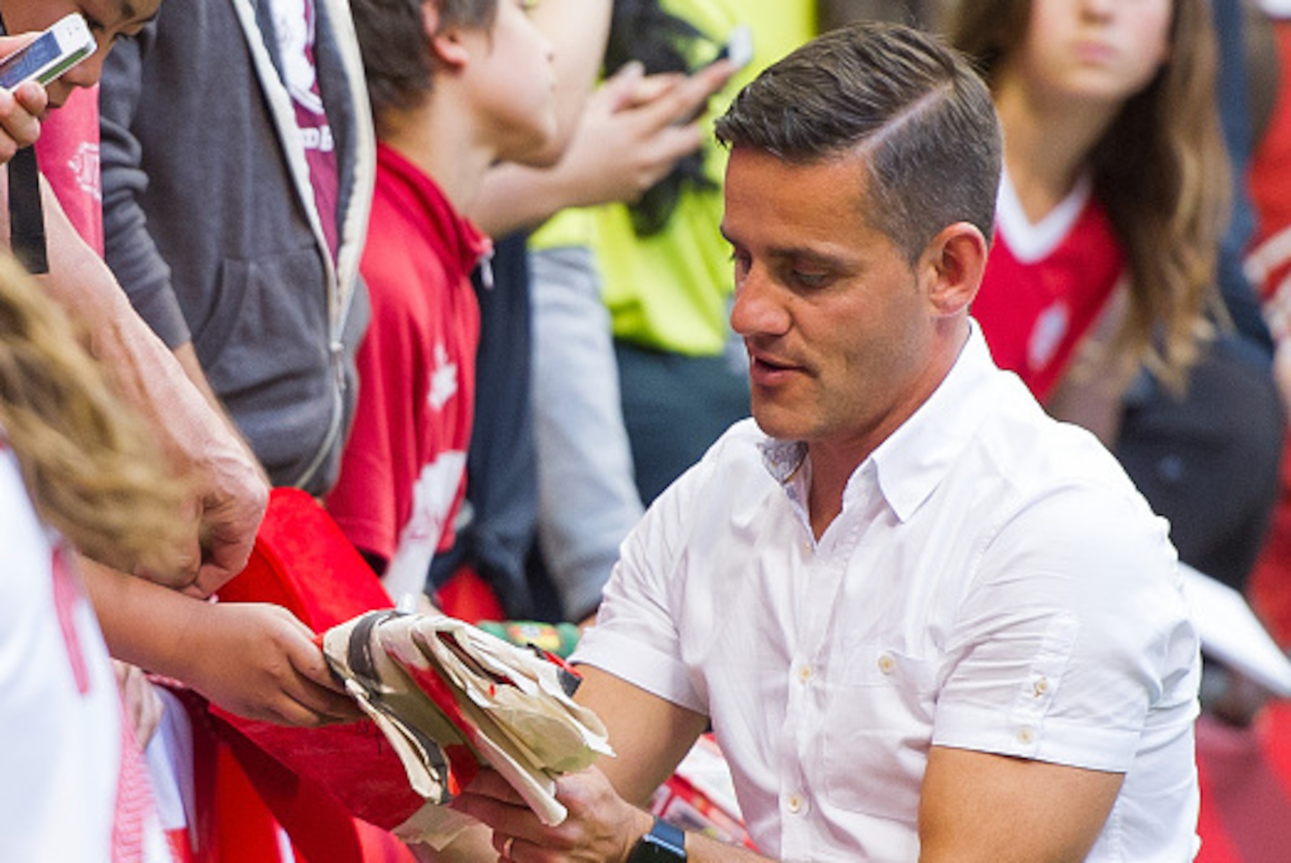 VANCOUVER, BC - JUNE 21: John Herdman Head Coach of Canada signs autographs after the FIFA Women's World Cup Canada 2015 Round of 16 match between Switzerland and Canada June, 21, 2015 at BC Place Stadium in Vancouver, British Columbia, Canada.  (Photo by