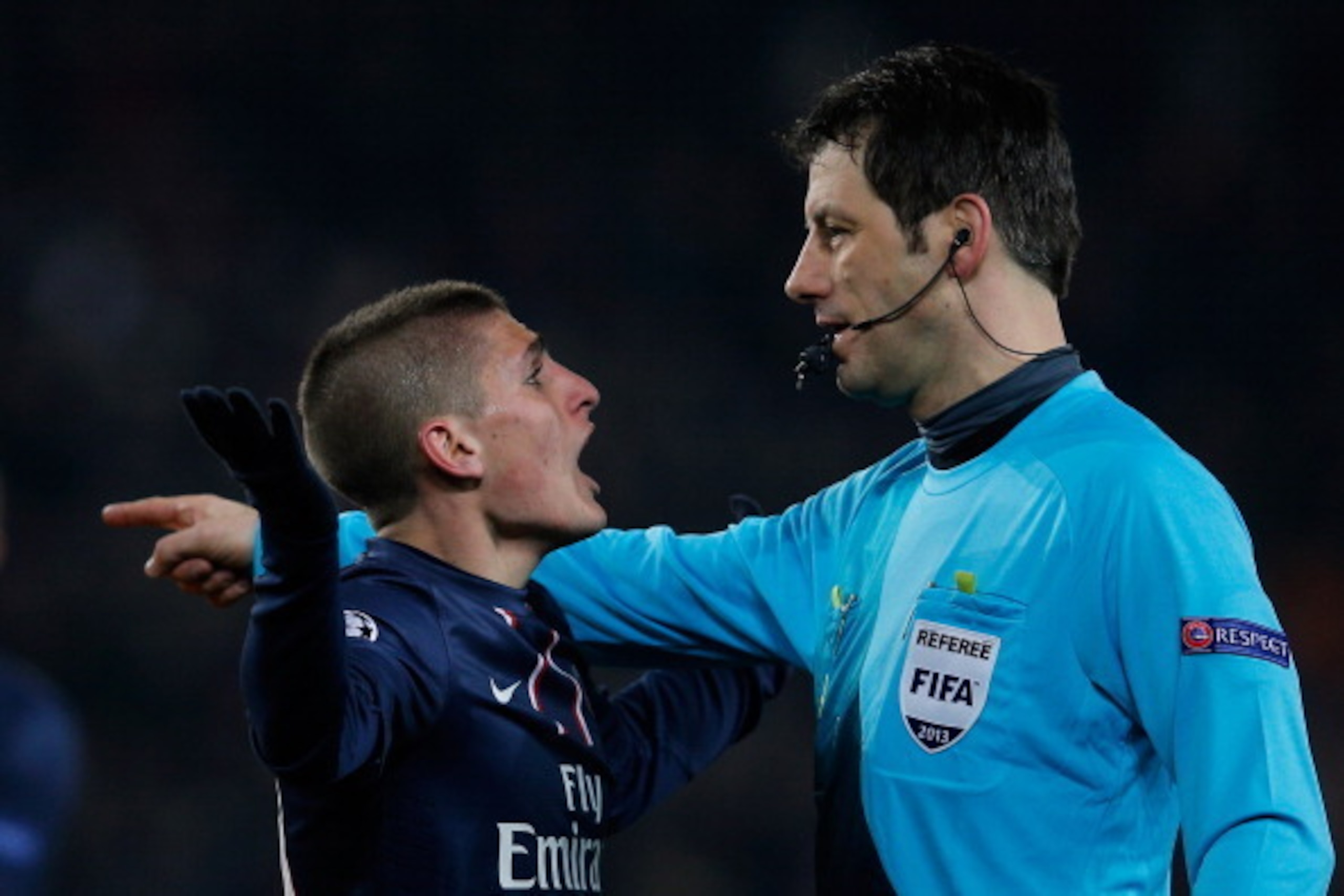 PARIS, FRANCE - APRIL 02:  Marco Verratti of PSG has words with referee, Wolfgang Stark of Germany after he gives a penalty to Barcelona during the UEFA Champions League Quarter Final match between Paris Saint-Germain and Barcelona FCB at Parc des Princes