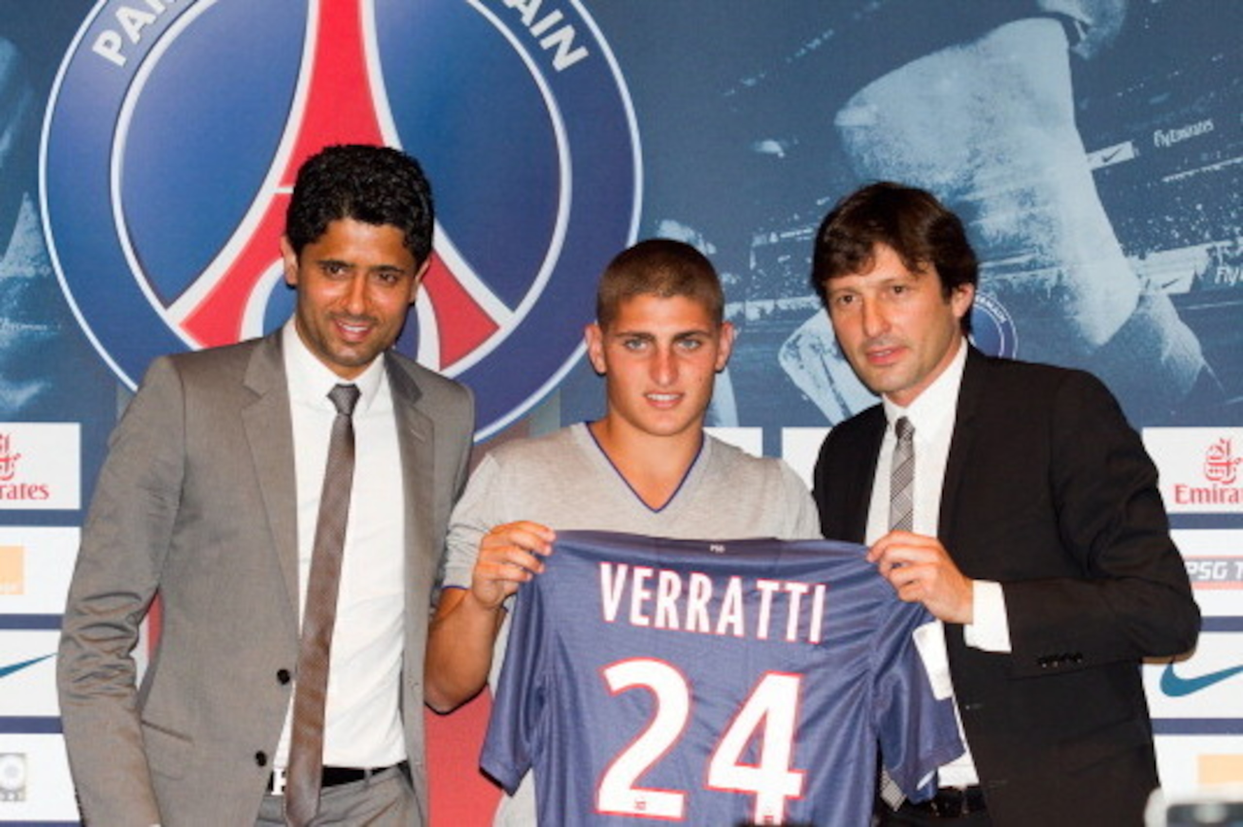 PARIS, FRANCE - JULY 18:  Marco Verratti (C) attends a press conference with Paris Saint-Germain chairman Nasser Al-Khelaifi (L) and PSG's sporting director Leonardo, as Verratti signs for Paris Saint-Germain, on July 18, 2012 in Paris, France.  (Photo by