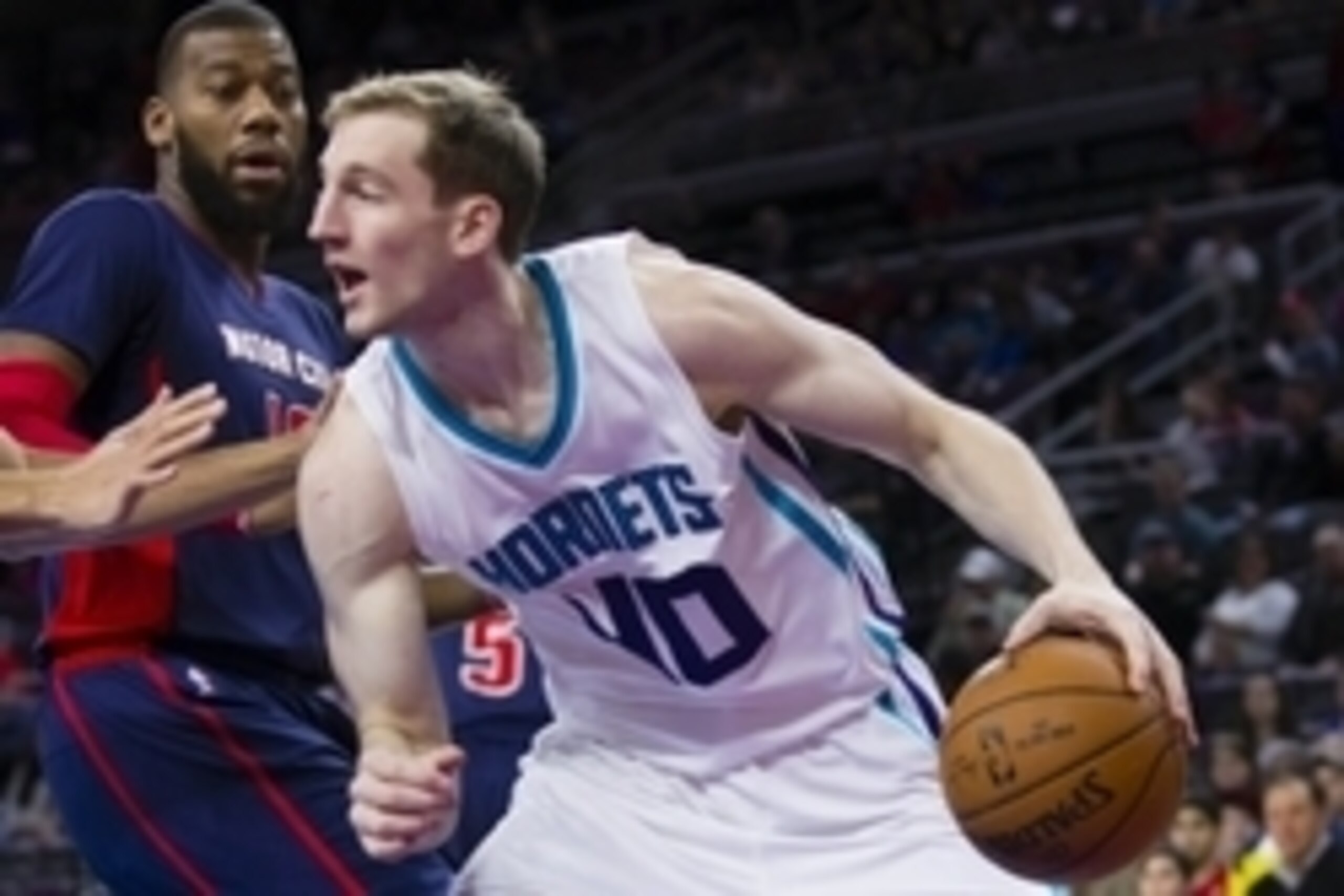 Mar 8, 2015; Auburn Hills, MI, USA; Charlotte Hornets forward Cody Zeller (40) moves the ball defended by Detroit Pistons forward Greg Monroe (10) in the first quarter at The Palace of Auburn Hills. Mandatory Credit: Rick Osentoski-USA TODAY Sports
