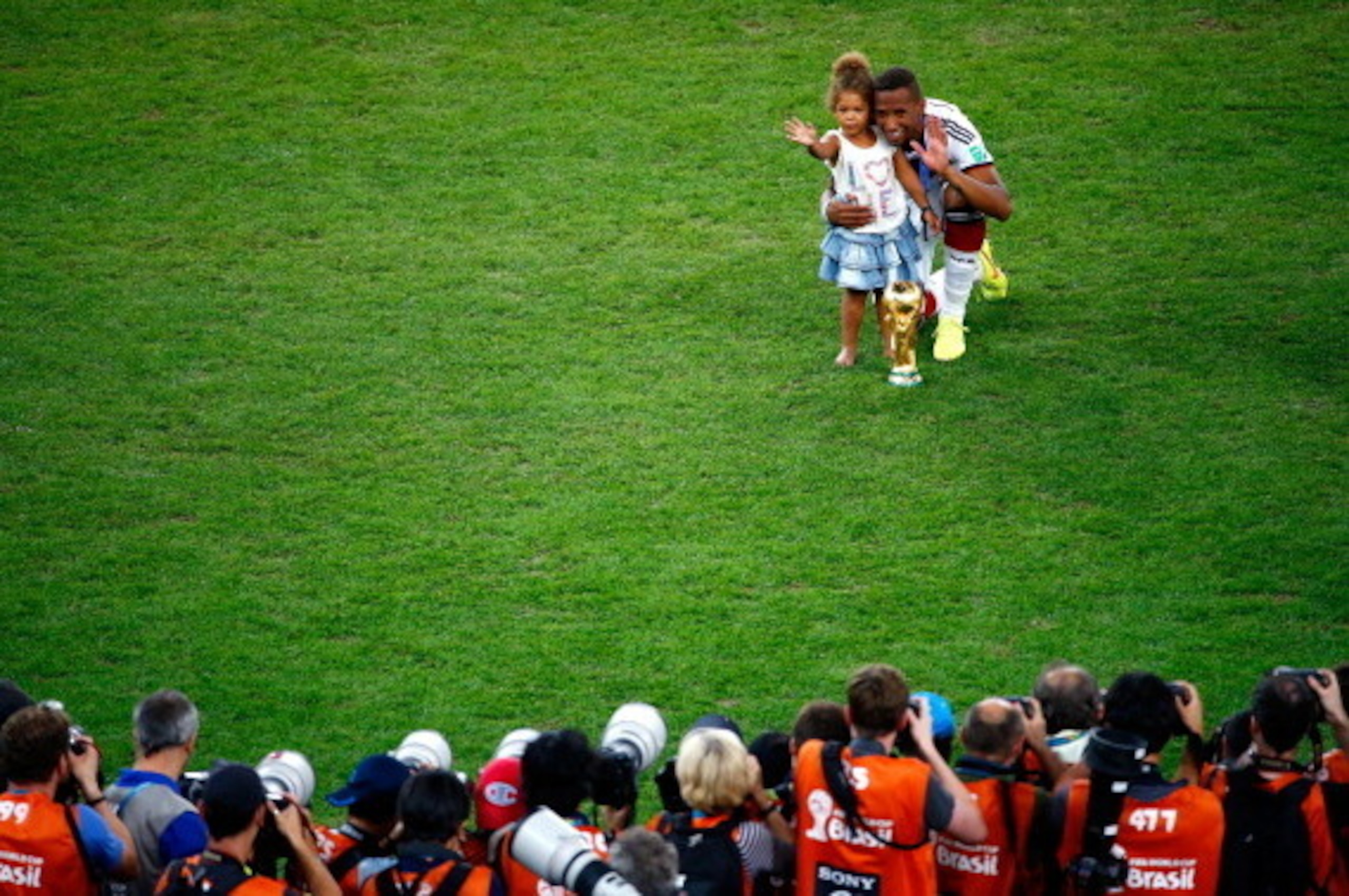 RIO DE JANEIRO, BRAZIL - JULY 13: Jerome Boateng of Germany celebrates with his daughter after defeating Argentina 1-0 in extra time during the 2014 FIFA World Cup Brazil Final match between Germany and Argentina at Maracana on July 13, 2014 in Rio de Jan RIO DE JANEIRO, BRAZIL - JULY 13: Jerome Boateng of Germany celebrates with his daughter after defeating Argentina 1-0 in extra time during the 2014 FIFA World Cup Brazil Final match between Germany and Argentina at Maracana on July 13, 2014 in Rio de Jan