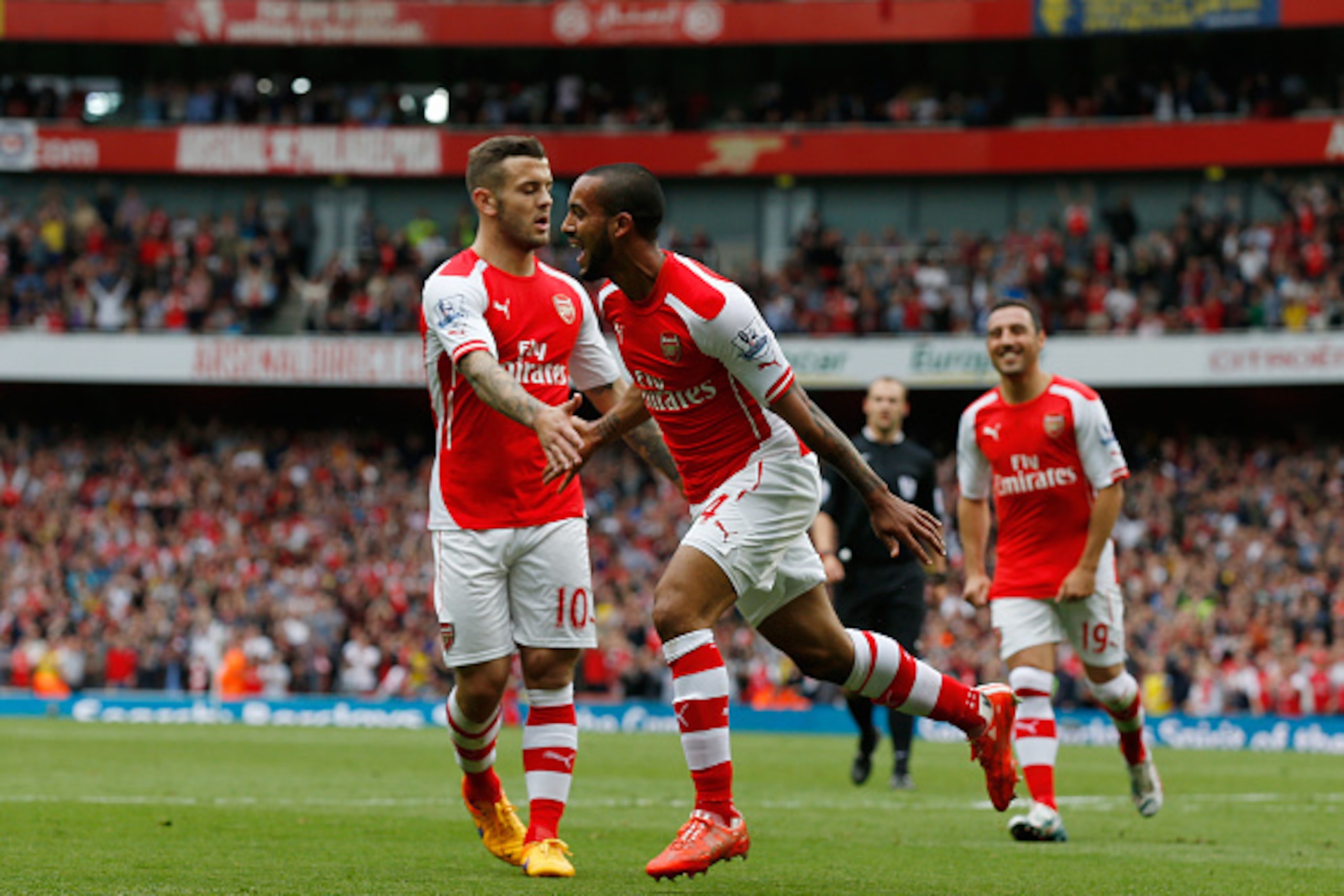 LONDON, ENGLAND - MAY 24:  Theo Walcott of Arsenal celebrates scoring his team's second goal during the Barclays Premier League match between Arsenal and West Bromwich Albion at Emirates Stadium on May 24, 2015 in London, England.  (Photo by Steve Bardens