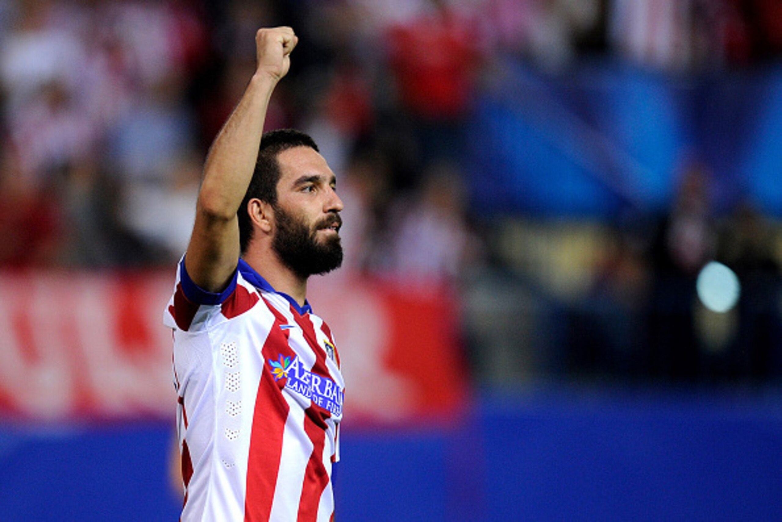 MADRID, SPAIN - OCTOBER 01:  Arda Turan of Club Atletico de Madrid celebrates after scoring his team's opening goal during the UEFA Champions League Group A match between Club Atletico de Madrid and Juventus at Vicente Calderon Stadium on October 1, 2014 