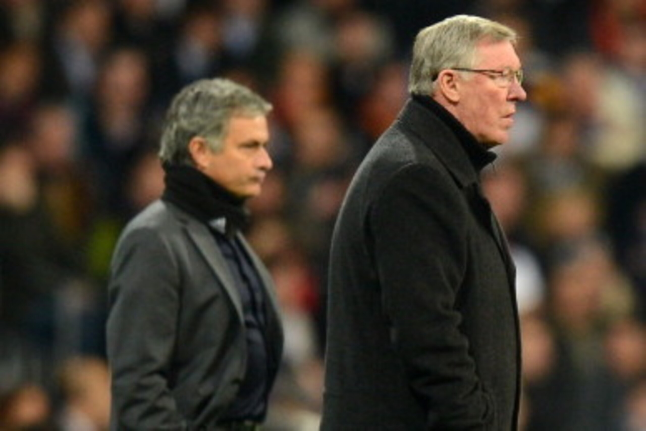 MADRID, SPAIN - FEBRUARY 13:  Head Coach Jose Mourinho of Real Madrid and Manager Sir Alex Ferguson of Manchester United look on during the UEFA Champions League Round of 16 first leg match between Real Madrid and Manchester United at Estadio Santiago Ber