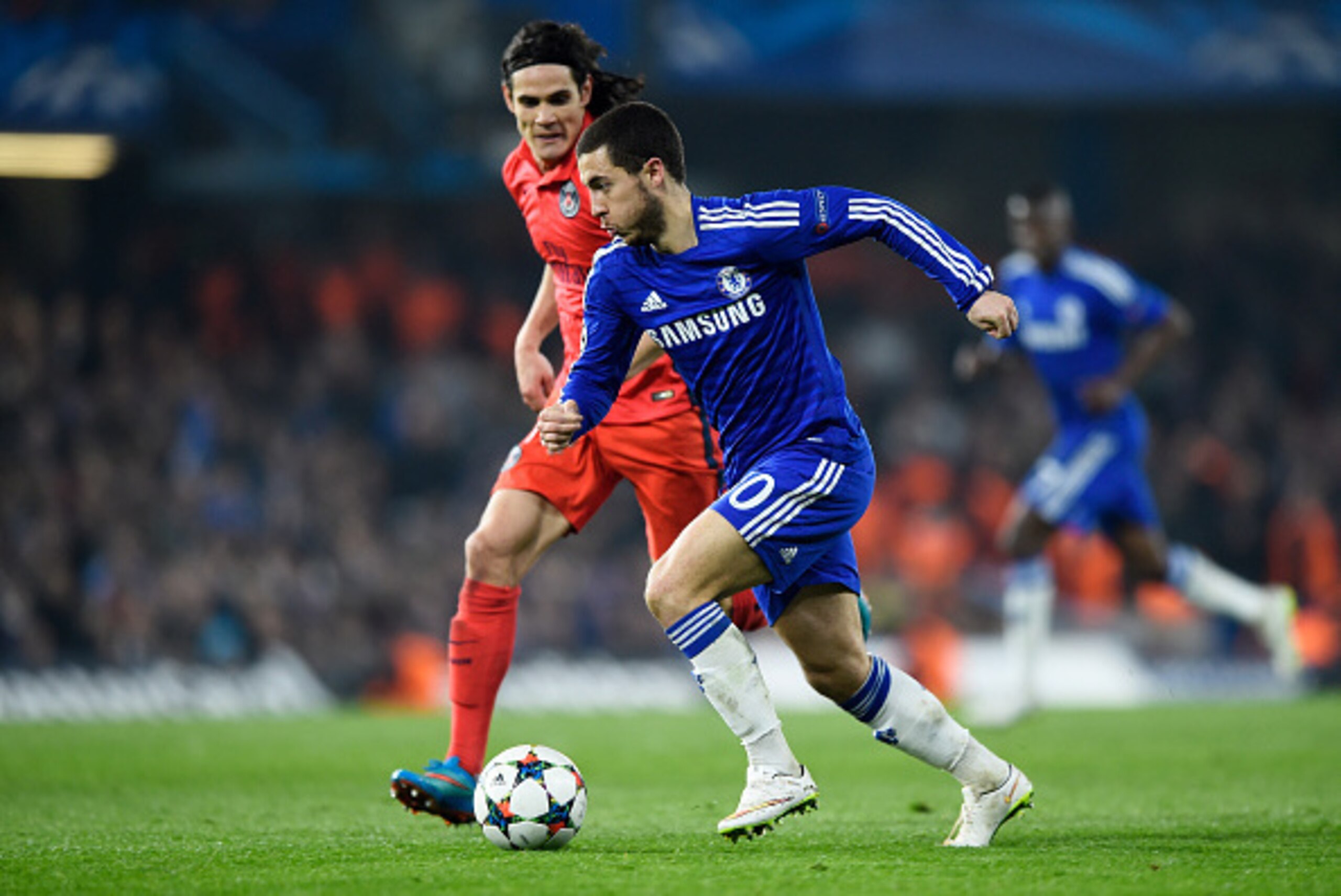 LONDON, ENGLAND - MARCH 11:  Eden Hazard of Chelsea is challenged by Edinson Cavani of PSG during the UEFA Champions League Round of 16, second leg match between Chelsea and Paris Saint-Germain at Stamford Bridge on March 11, 2015 in London, England.  (Ph