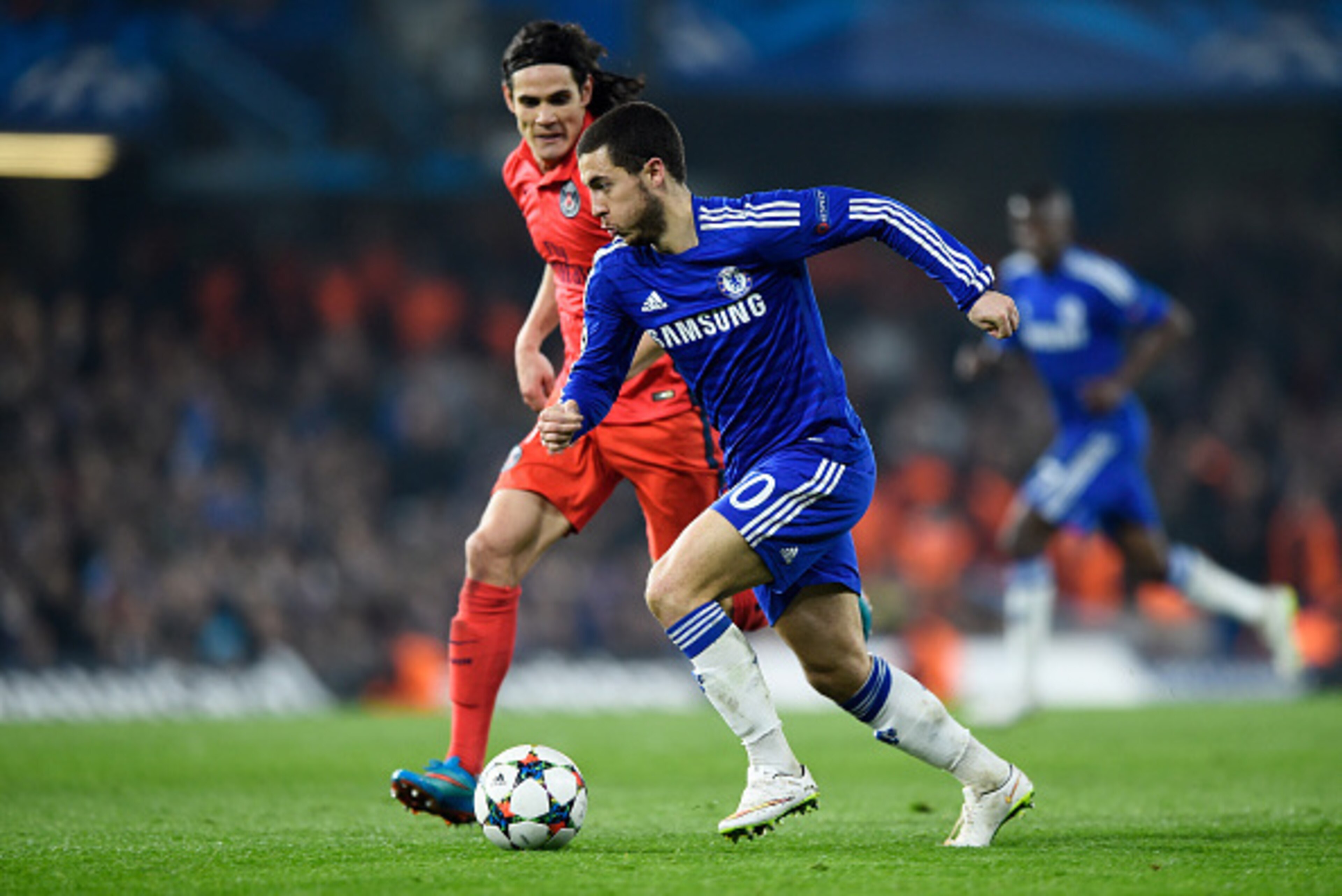 LONDON, ENGLAND - MARCH 11:  Eden Hazard of Chelsea is challenged by Edinson Cavani of PSG during the UEFA Champions League Round of 16, second leg match between Chelsea and Paris Saint-Germain at Stamford Bridge on March 11, 2015 in London, England.  (Ph