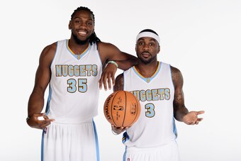 DENVER, CO - SEPTEMBER 29: Kenneth Faried #35 and Ty Lawson #3 of the Denver Nuggets pose for photos during media day on September 29, 2014 at the Pepsi Center in Denver, Colorado. NOTE TO USER: User expressly acknowledges and agrees that, by downloading