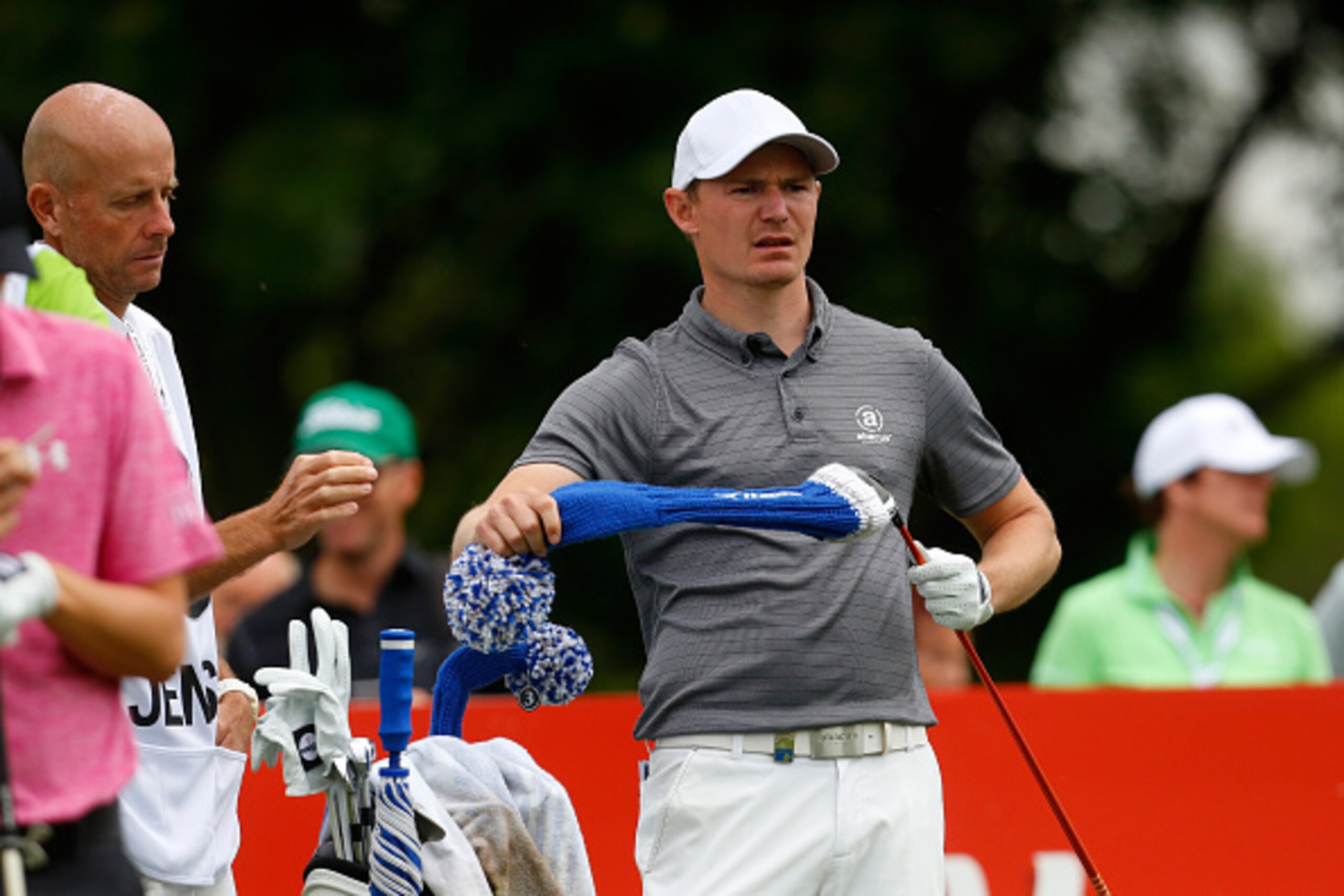 MUNICH, GERMANY - JUNE 25: Lasse Jensen of Denmark takes a club from his bag during the BMW International Open day one at the Eichenried Golf Club on June 25, 2015 in Munich, Germany. (Photo by Paul Thomas/Getty Images)