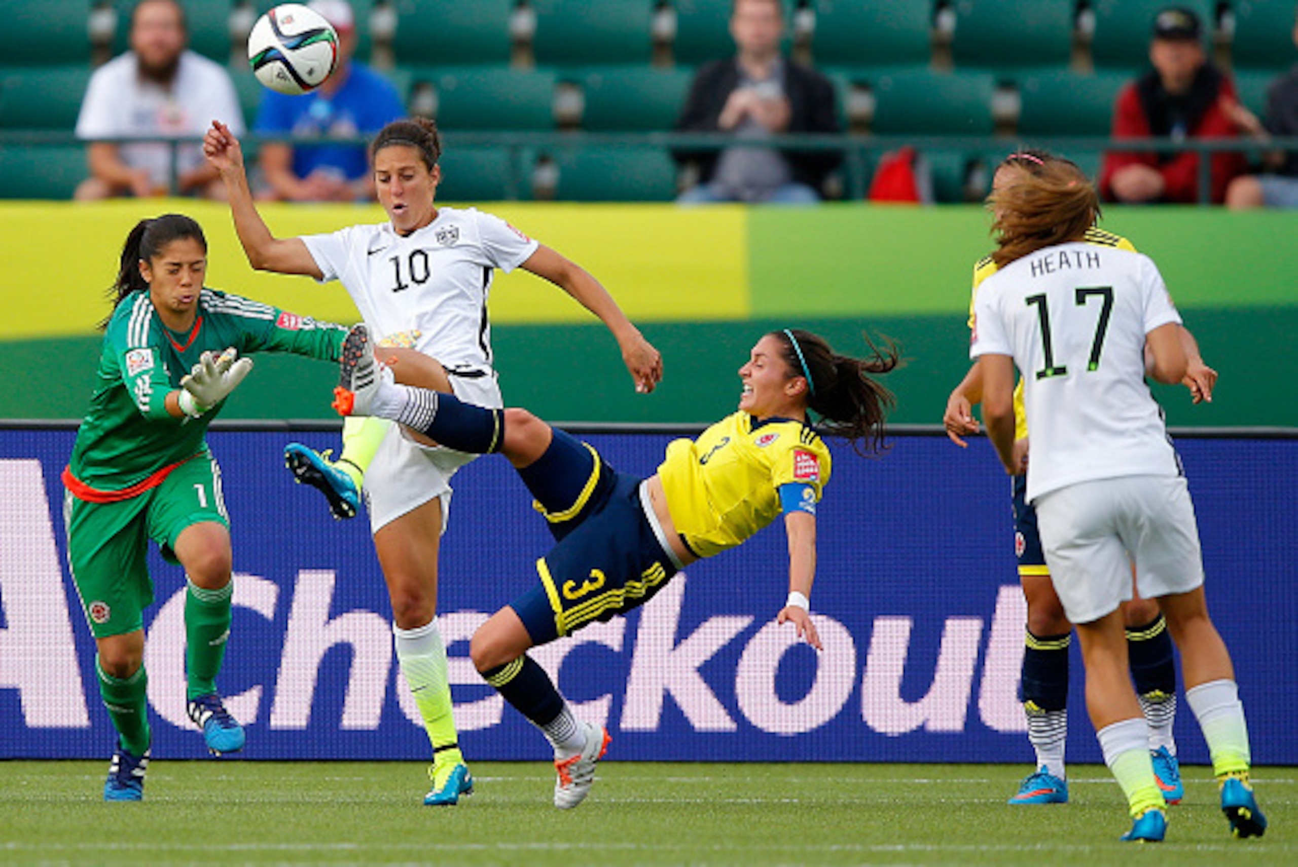 EDMONTON, AB - JUNE 22:  Carli Lloyd #10 of the United States goes for the ball between goalkeeper Stefany Castano #1 and Natalia Gaitan #3 of Colombia in the second half in the FIFA Women's World Cup 2015 Round of 16 match at Commonwealth Stadium on June