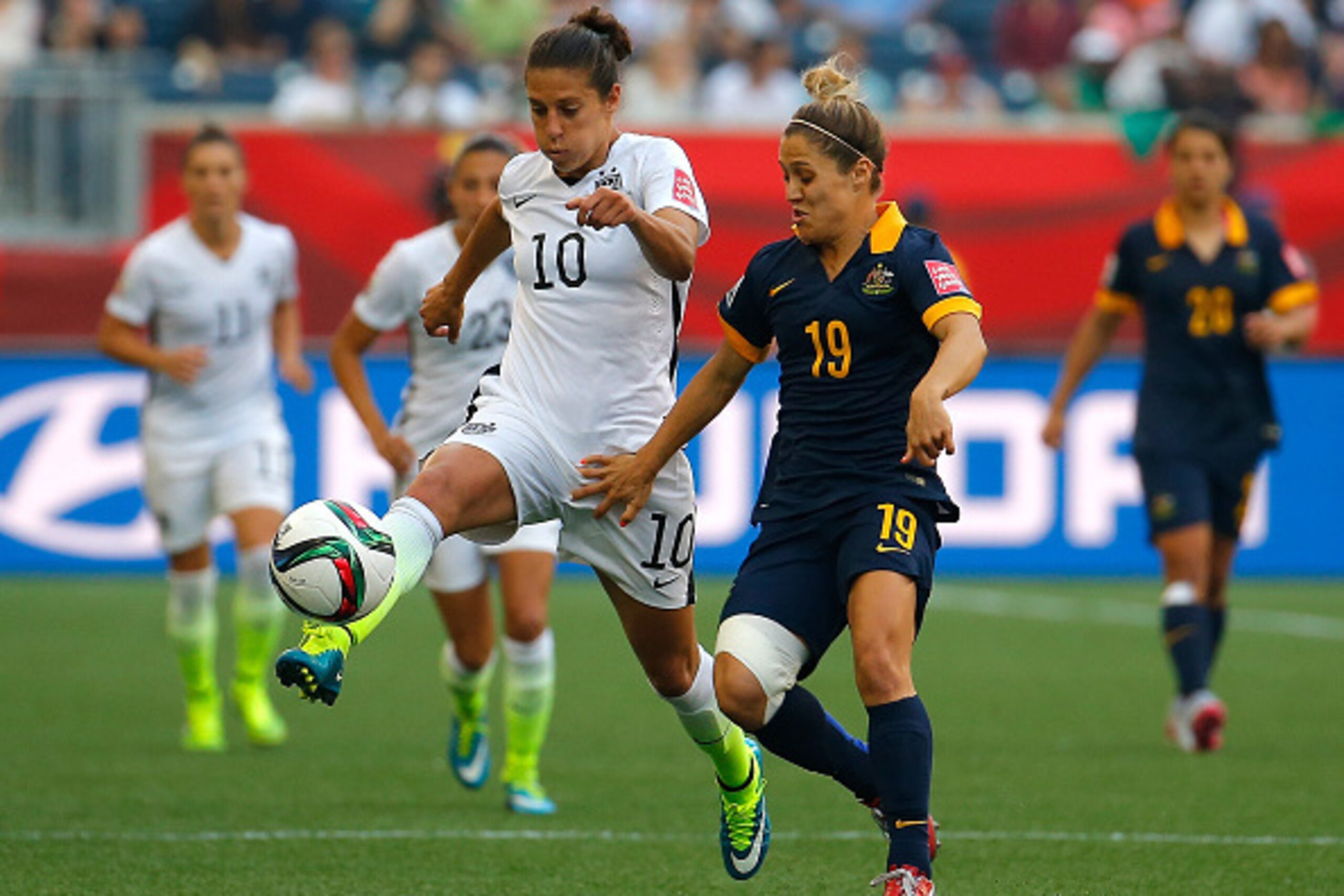 WINNIPEG, MB - JUNE 08:  Carli Lloyd #10 of the United States of America against Katrina Gorry #19 of Australia during the FIFA Women's World Cup Canada 2015 Group D match between the United States and Australia at Winnipeg Stadium on June 8, 2015 in Winn