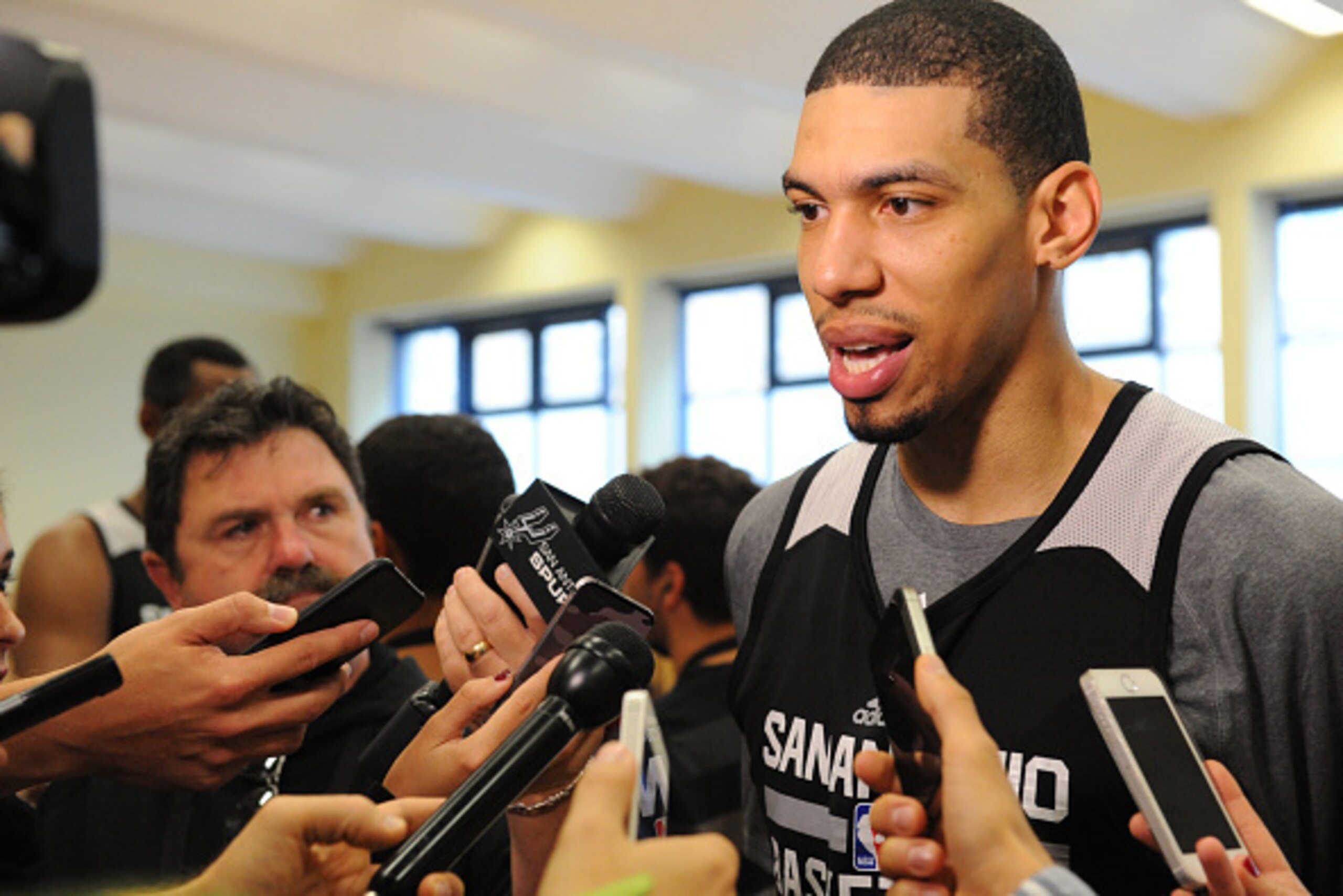BERLIN - OCTOBER 6: Danny Green #14 of the San Antonio Spurs talks to the media during practice as part of the 2014 Global Games on October 6, 2014 at the Alba practice facility in Berlin, Germany. NOTE TO USER: User expressly acknowledges and agrees that