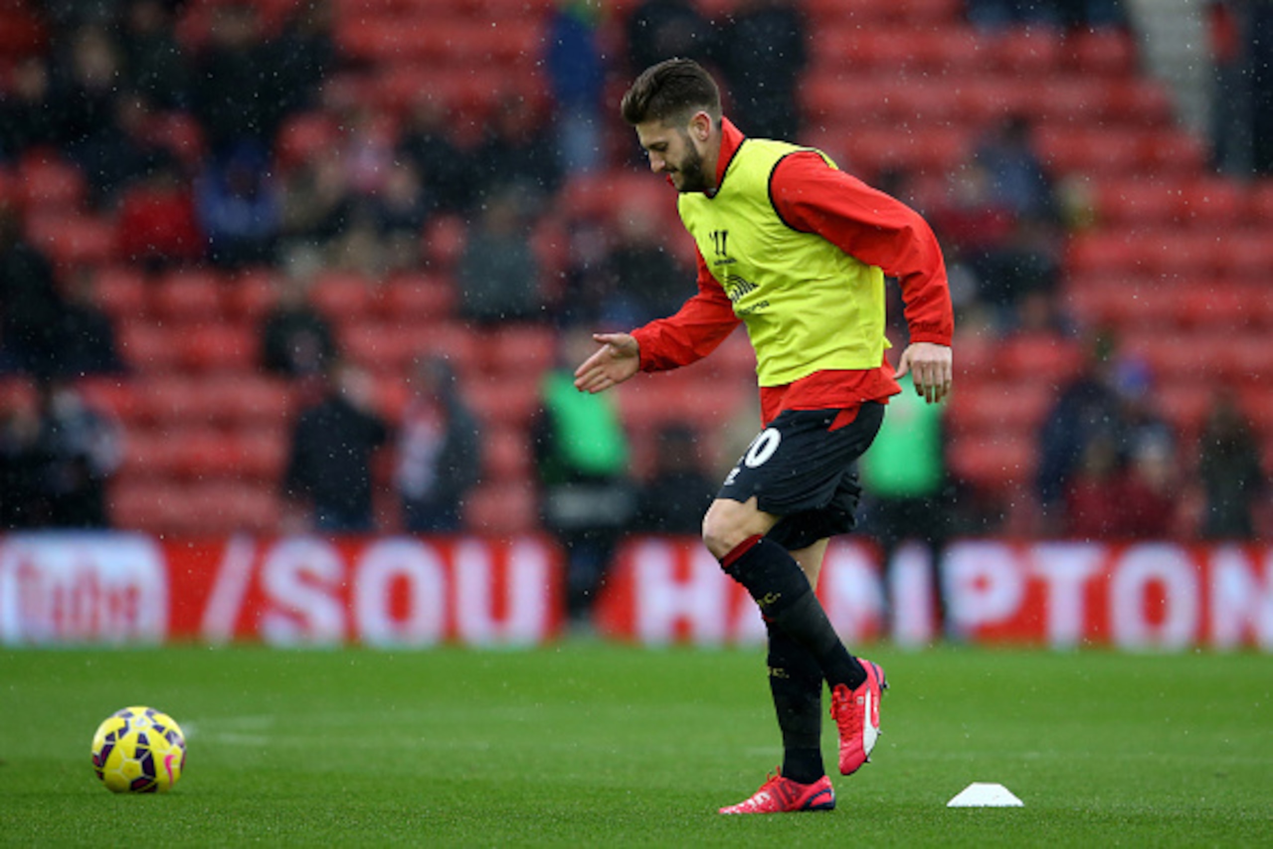 SOUTHAMPTON, ENGLAND - FEBRUARY 22:  Adam Lallana of Liverpool warms up prior to kickoff during the Barclays Premier League match between Southampton and Liverpool at St Mary's Stadium on February 22, 2015 in Southampton, England.  (Photo by Richard Heath