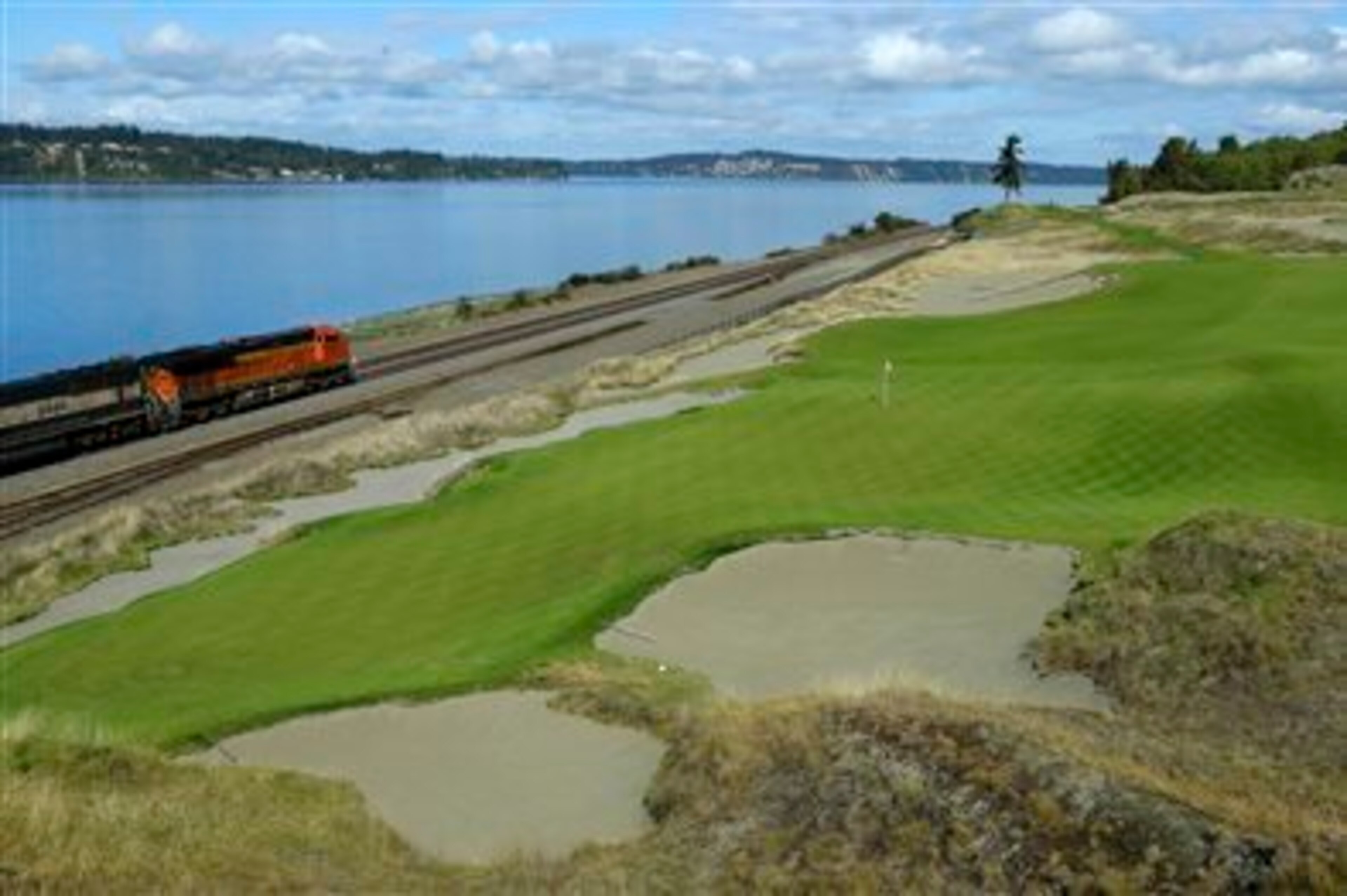 Chance to view along the 16th and 17th holes was lost because of the drop down to the track level. A boardwalk would have allowed actual views of the golf course, not just the fescue. Mounds on the other side obscured play. Chance to view along the 16th and 17th holes was lost because of the drop down to the track level. A boardwalk would have allowed actual views of the golf course, not just the fescue. Mounds on the other side obscured play.
