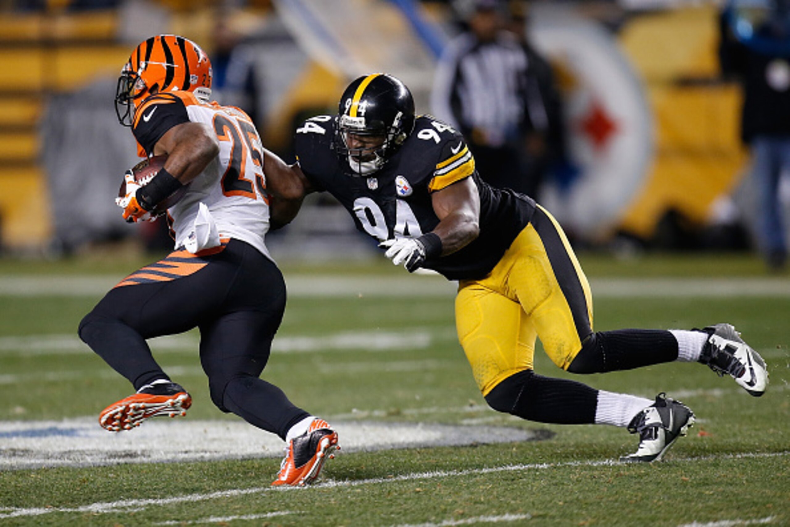 PITTSBURGH, PA - DECEMBER 28:  Giovani Bernard #25 of the Cincinnati Bengals gets past the defense of Lawrence Timmons #94 of the Pittsburgh Steelers during the second quarter at Heinz Field on December 28, 2014 in Pittsburgh, Pennsylvania.  (Photo by Gre