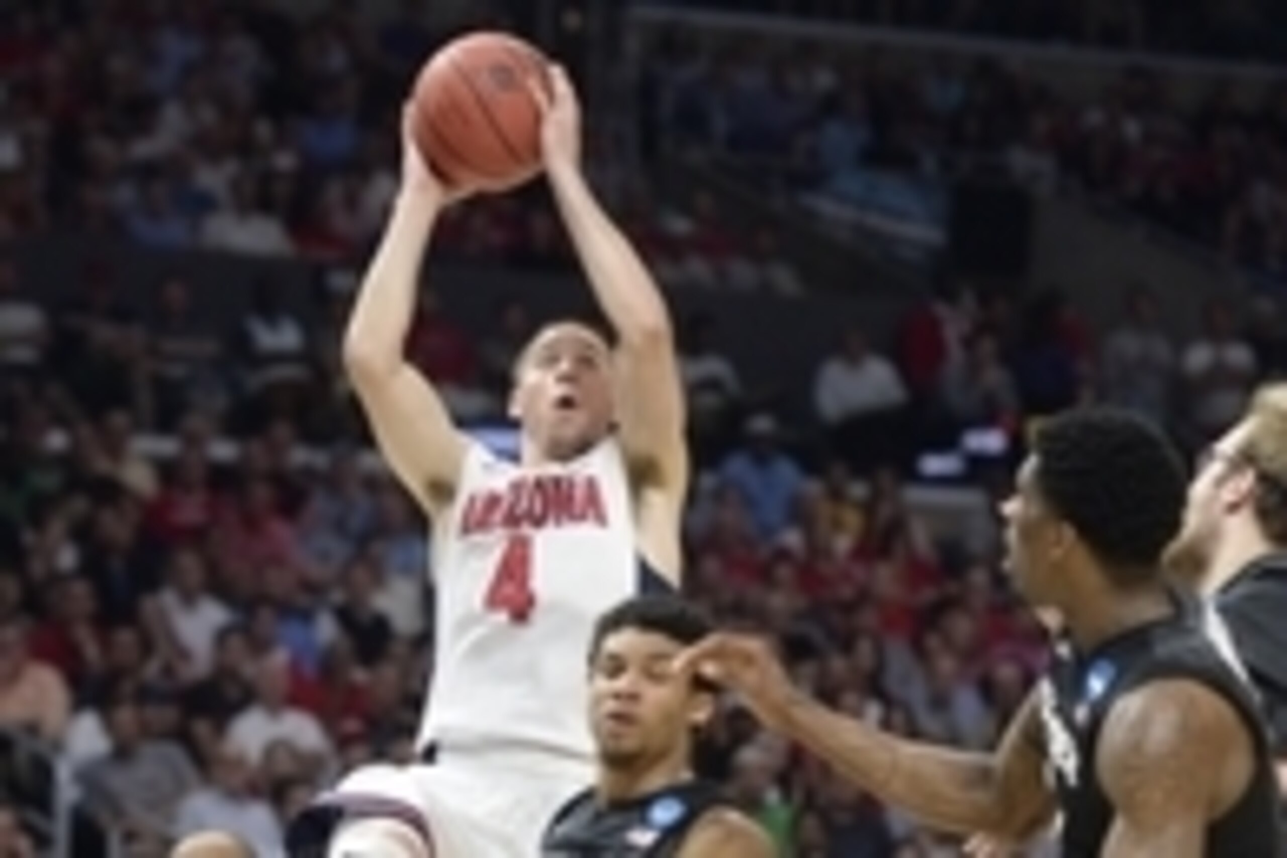 Mar 26, 2015; Los Angeles, CA, USA; Arizona Wildcats guard T.J. McConnell (4) moves to the basket against Xavier Musketeers guard Dee Davis (11) during the first half in the semifinals of the west regional of the 2015 NCAA Tournament at Staples Center. Ma