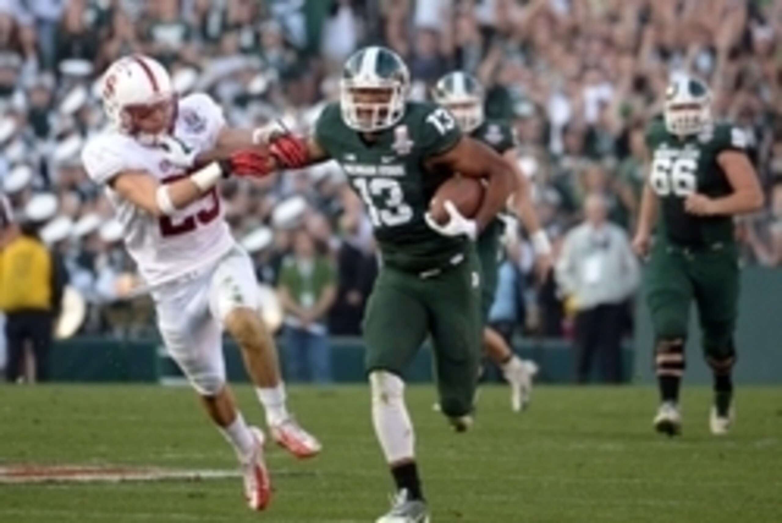 Jan 1, 2014; Pasadena, CA, USA; Michigan State Spartans receiver Bennie Fowler (13) is defended by Stanford Cardinal safety Ed Reynolds (29) on a 60-yard reception in the third quarter in the 100th Rose Bowl. Michigan State defeated Stanford 24-20. Mandat Jan 1, 2014; Pasadena, CA, USA; Michigan State Spartans receiver Bennie Fowler (13) is defended by Stanford Cardinal safety Ed Reynolds (29) on a 60-yard reception in the third quarter in the 100th Rose Bowl. Michigan State defeated Stanford 24-20. Mandat