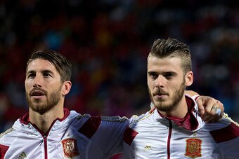LEON, SPAIN - JUNE 11: Goalkeeper David de Gea (R) of Spain listen to the Spanish national anthem embraced to his teammate Sergio Ramos (R) during the international friendly match between Spain and Costa Rica at Reino de Leon Stadium on June 11, 2015 in L