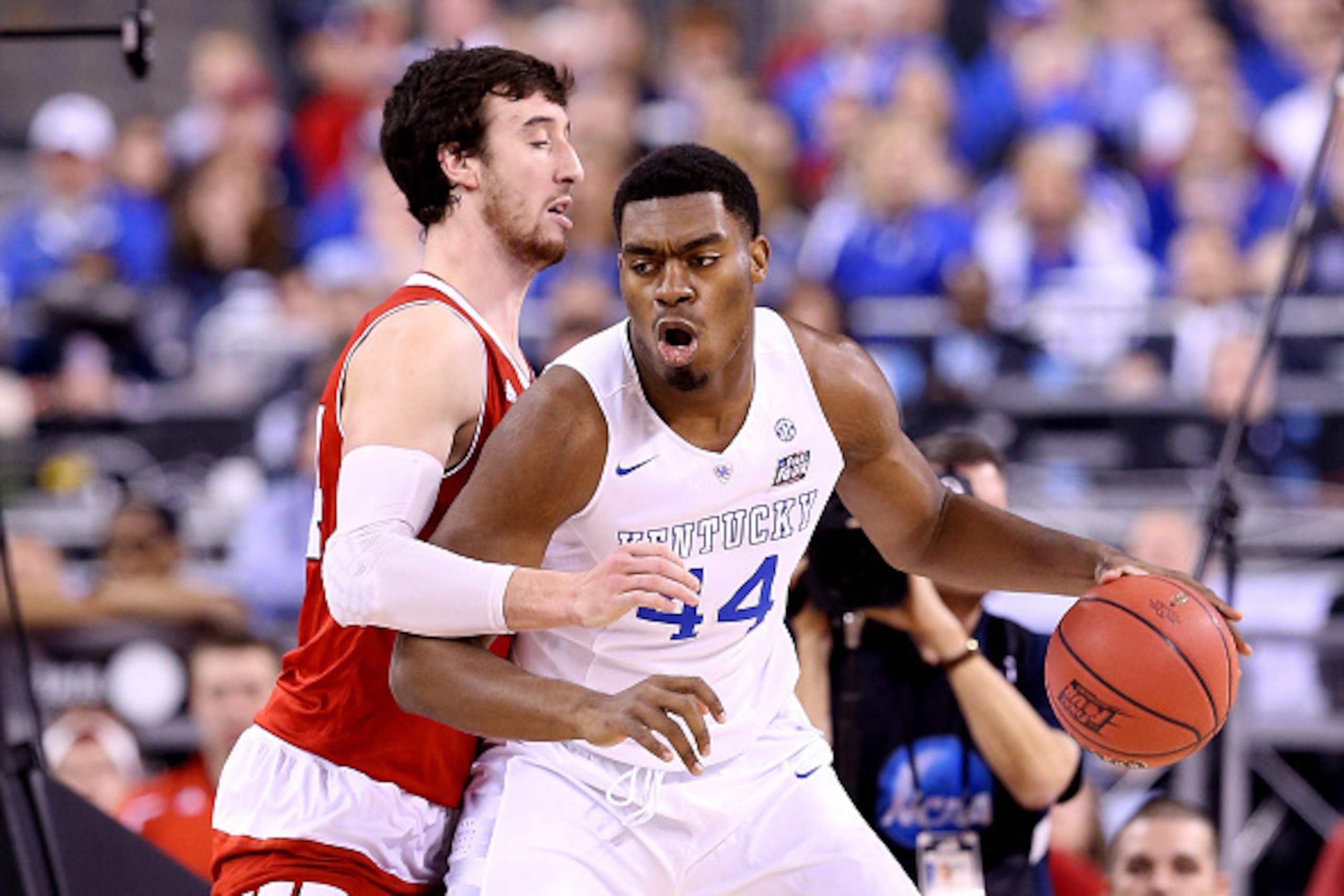 INDIANAPOLIS, IN - APRIL 04: Dakari Johnson #44 of the Kentucky Wildcats handles the ball against Frank Kaminsky #44 of the Wisconsin Badgers in the first half during the NCAA Men's Final Four Semifinal at Lucas Oil Stadium on April 4, 2015 in Indianapoli