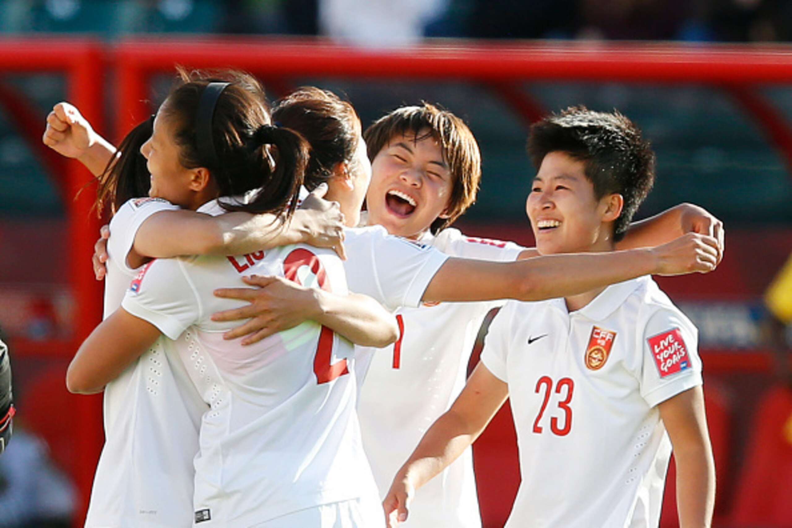EDMONTON, AB - JUNE 20: Team members of China celebrate their win over Cameroon during the FIFA Women's World Cup Canada Round 16 match between China and Cameroon at Commonwealth Stadium on June 20, 2015 in Edmonton, Alberta, Canada. (Photo by Todd Korol/