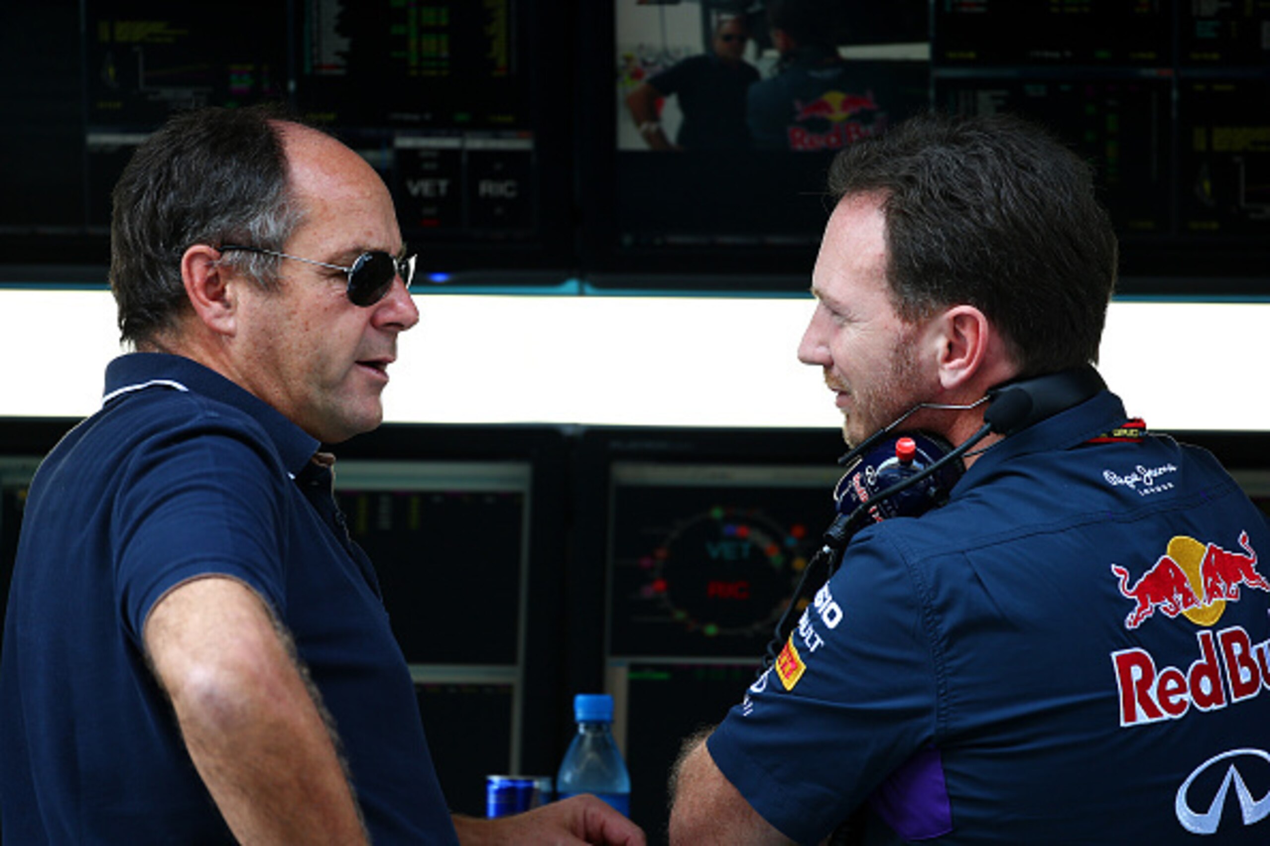 ABU DHABI, UNITED ARAB EMIRATES - NOVEMBER 21:  Infiniti Red Bull Racing Team Principal Christian Horner speaks with former driver Gerhard Berger on the pit wall during practice ahead of the Abu Dhabi Formula One Grand Prix at Yas Marina Circuit on Novemb