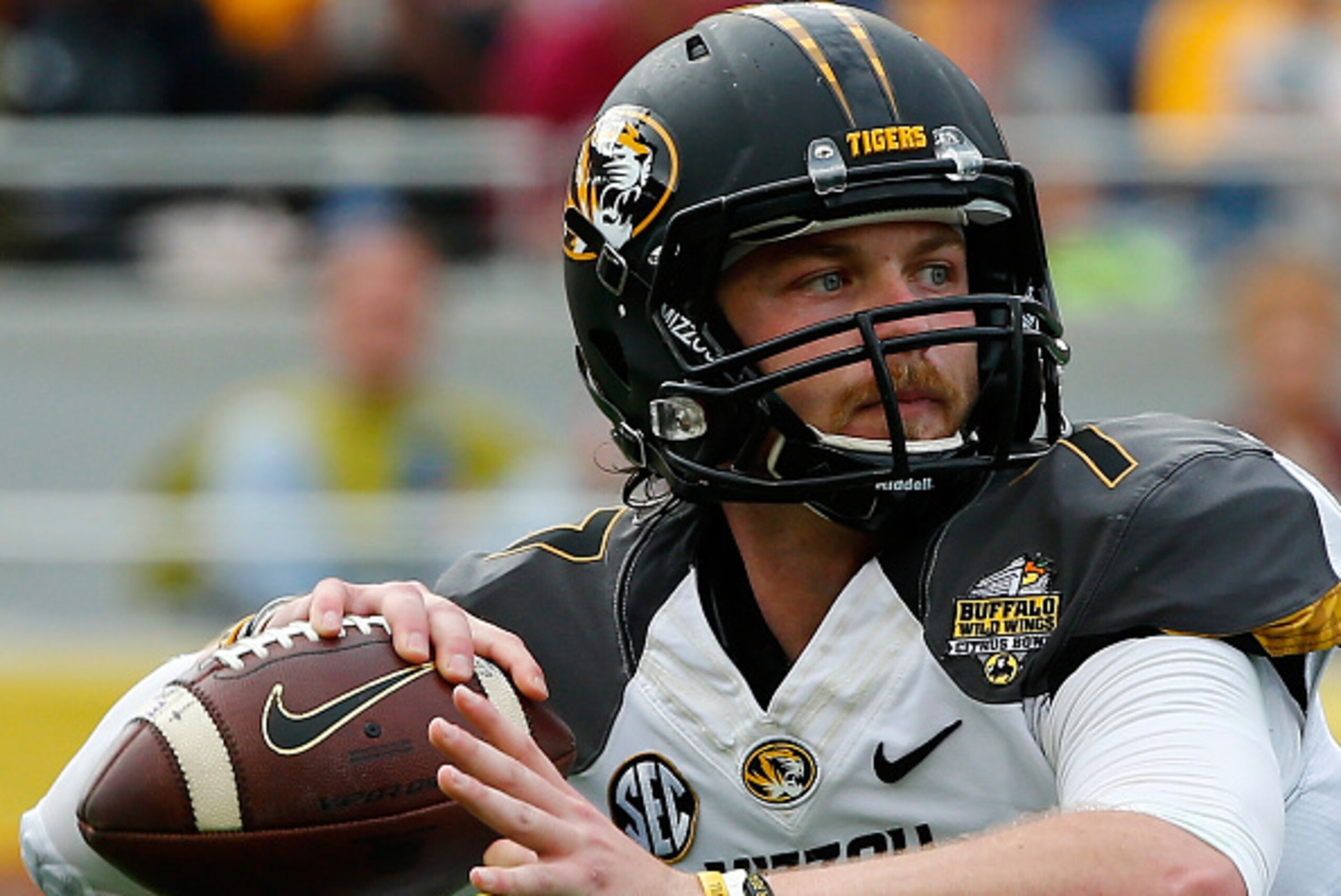 ORLANDO, FL - JANUARY 01:  Maty Mauk #7 of the Missouri Tigers attempts a pass during the Buffalo Wild Wings Citrus Bowl against the Minnesota Golden Gophers at the Florida Citrus Bowl on January 1, 2015 in Orlando, Florida.  (Photo by Sam Greenwood/Getty