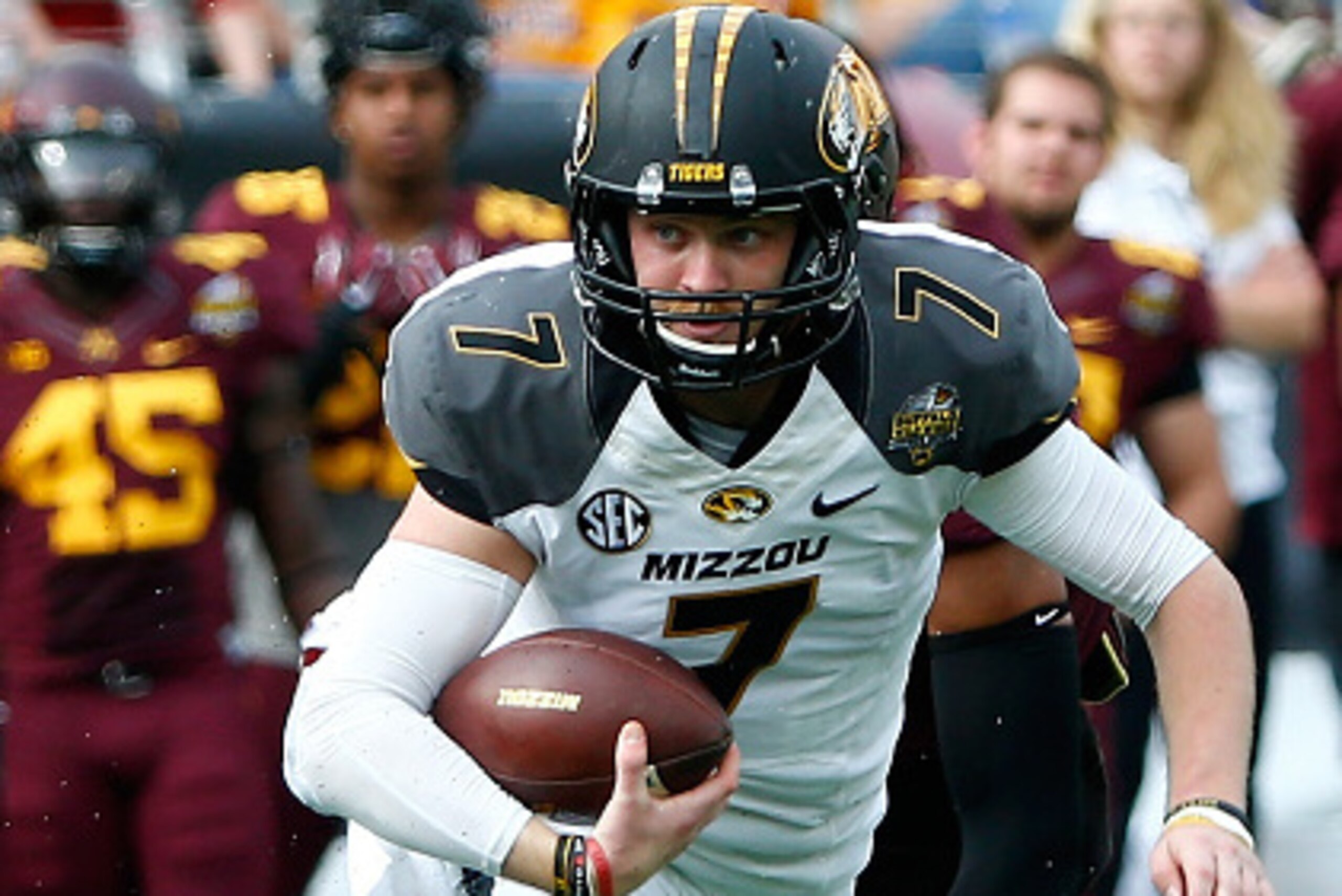 ORLANDO, FL - JANUARY 01:  Maty Mauk #7 of the Missouri Tigers scrambles for yardage during the Buffalo Wild Wings Citrus Bowl against the Minnesota Golden Gophers at the Florida Citrus Bowl on January 1, 2015 in Orlando, Florida.  (Photo by Sam Greenwood