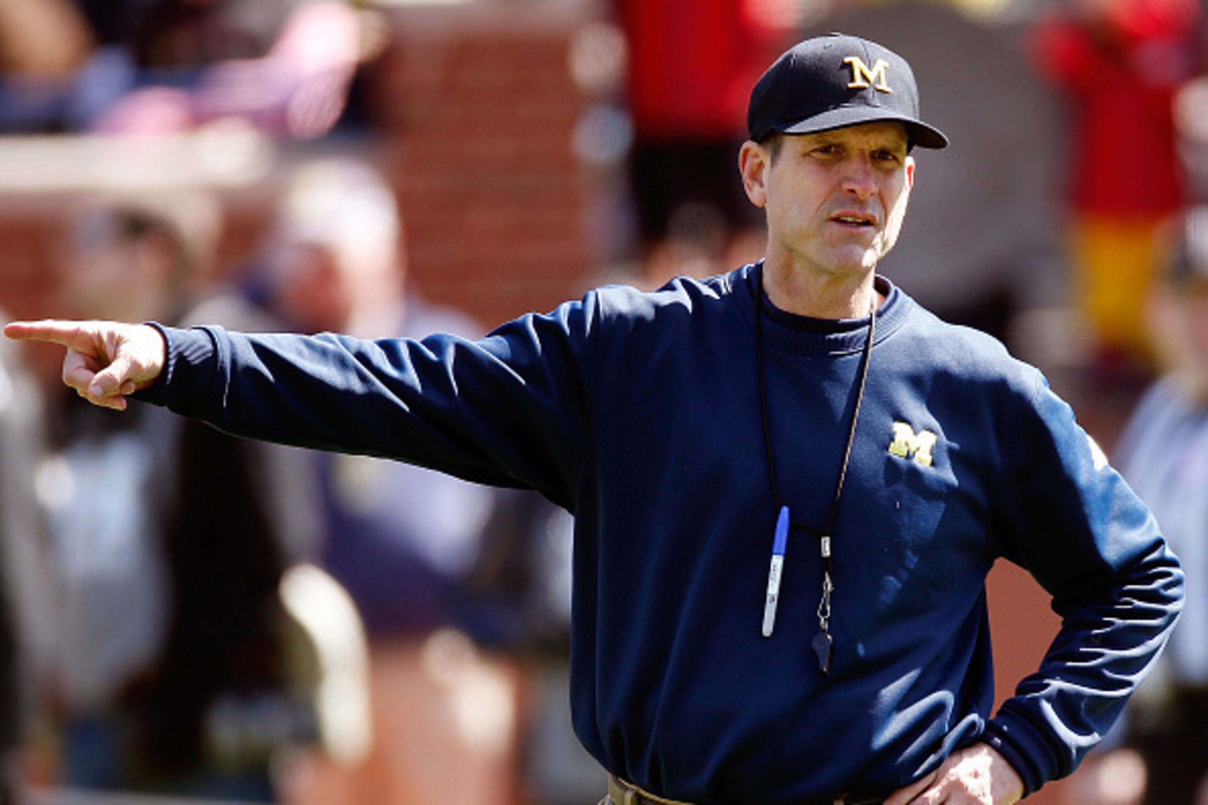 ANN ARBOR, MI - APRIL 04: Head coach Jim Harbaugh of the Michigan Wolverines looks on during the Michigan Football Spring Game on April 4, 2015 at Michigan Stadium in Ann Arbor, Michigan.  (Photo by Gregory Shamus/Getty Images)