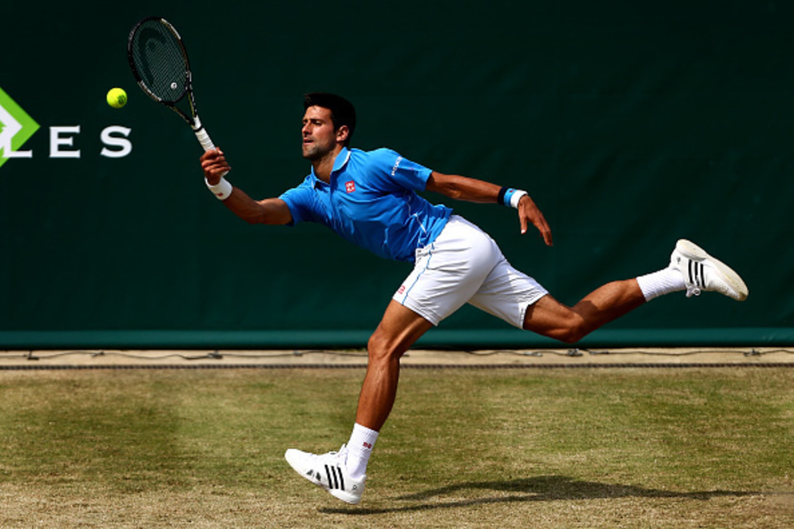 STOKE POGES, ENGLAND - JUNE 26:  Novak Djokovic of Serbia reaches for a forehand during his match against Alexander Zverev of Germany during Day 4 of The Boodles Tennis Event at Stoke Park on June 26, 2015 in Stoke Poges, England.  (Photo by Jordan Mansfi