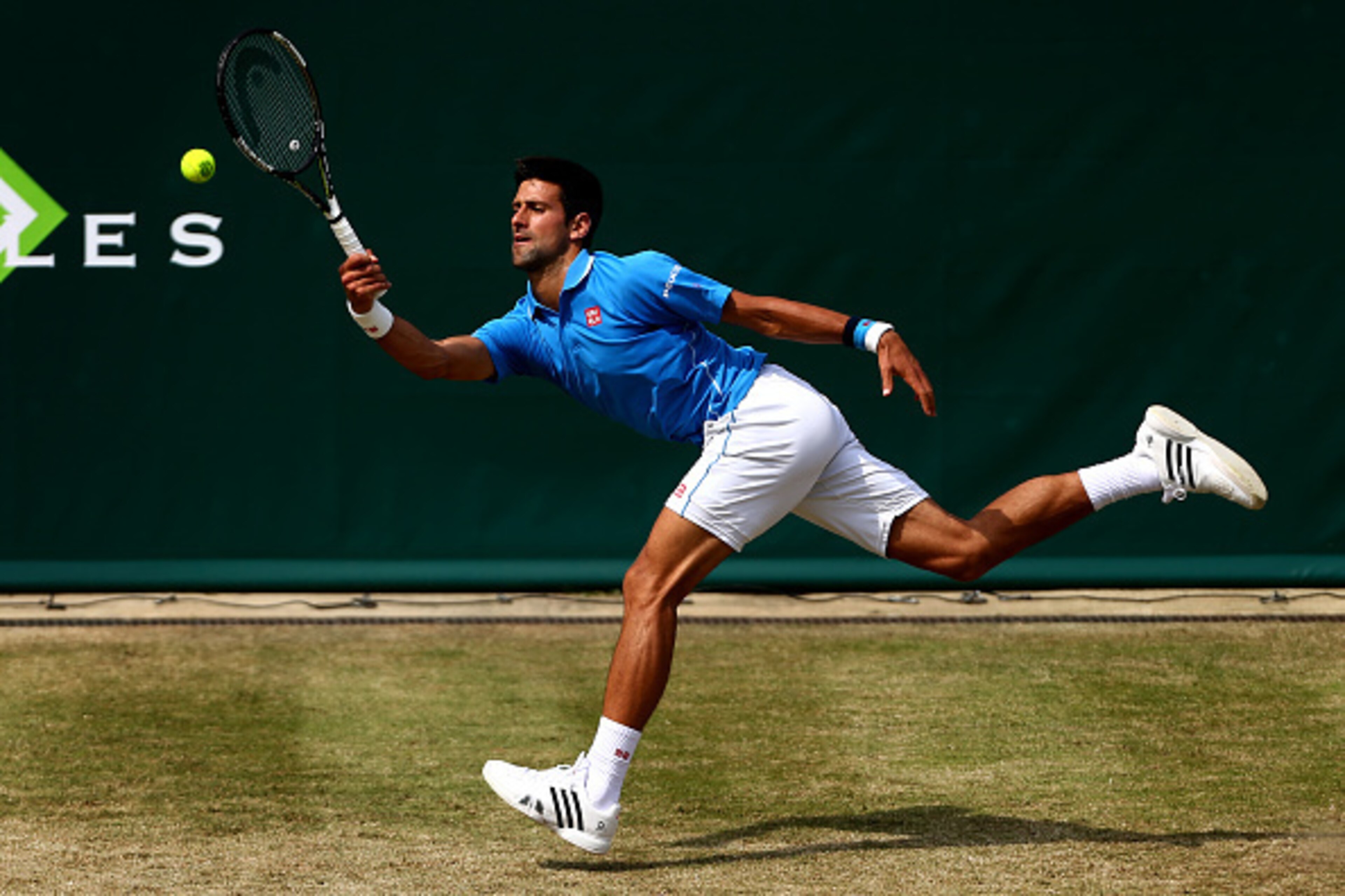 STOKE POGES, ENGLAND - JUNE 26:  Novak Djokovic of Serbia reaches for a forehand during his match against Alexander Zverev of Germany during Day 4 of The Boodles Tennis Event at Stoke Park on June 26, 2015 in Stoke Poges, England.  (Photo by Jordan Mansfi
