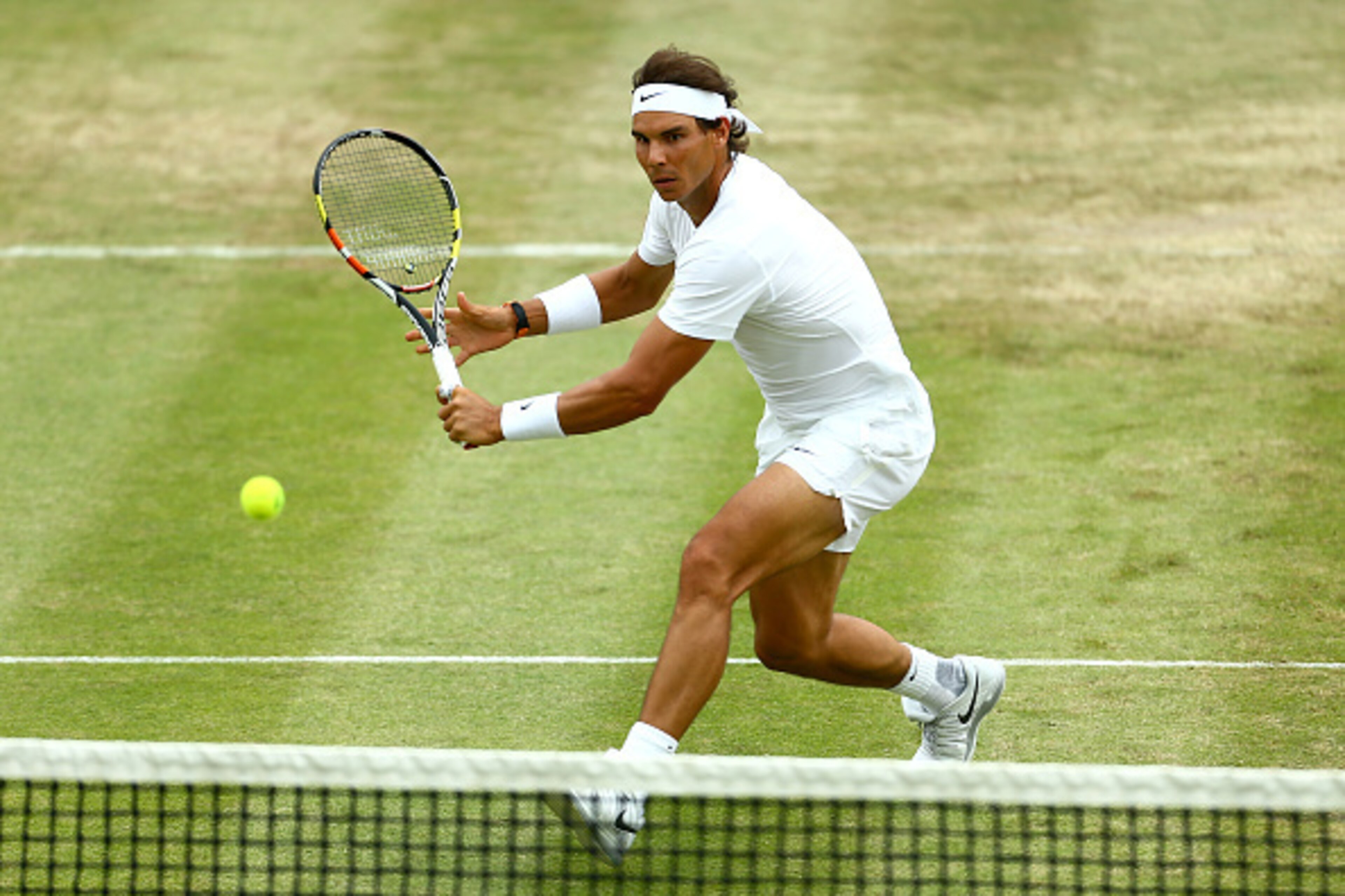 STOKE POGES, ENGLAND - JUNE 26:  Rafael Nadal of Spain plays a backhand during his match against Robin Haase of the Netherlands during Day 4 of The Boodles Tennis Event at Stoke Park on June 26, 2015 in Stoke Poges, England.  (Photo by Jordan Mansfield/Ge