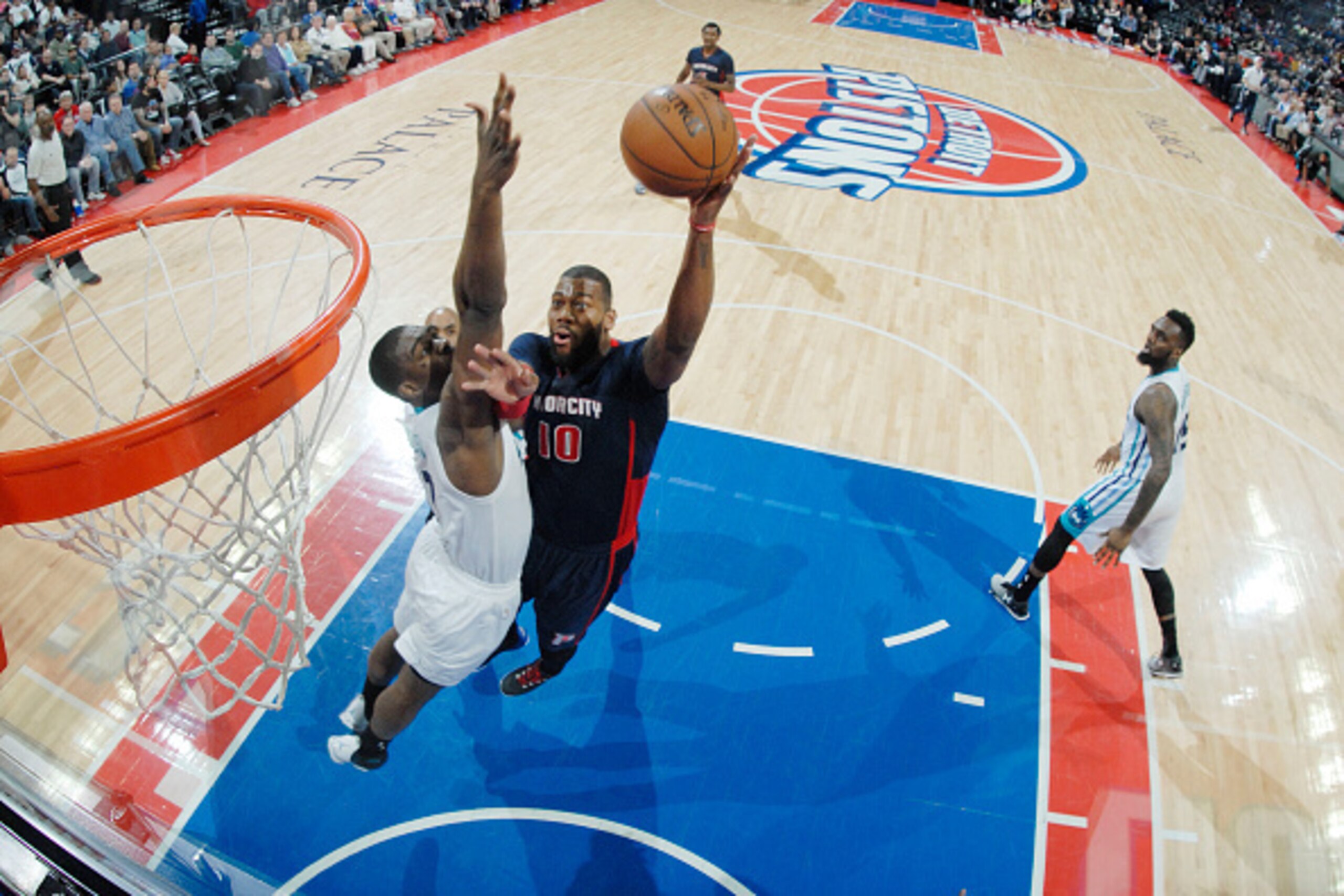 DETROIT, MI - APRIL 12: Greg Monroe #10 of the Detroit Pistons goes for the dunk against the Charlotte Hornets during the game on April 12, 2015 at The Palace of Auburn in Detroit, Michigan. NOTE TO USER: User expressly acknowledges and agrees that, by do