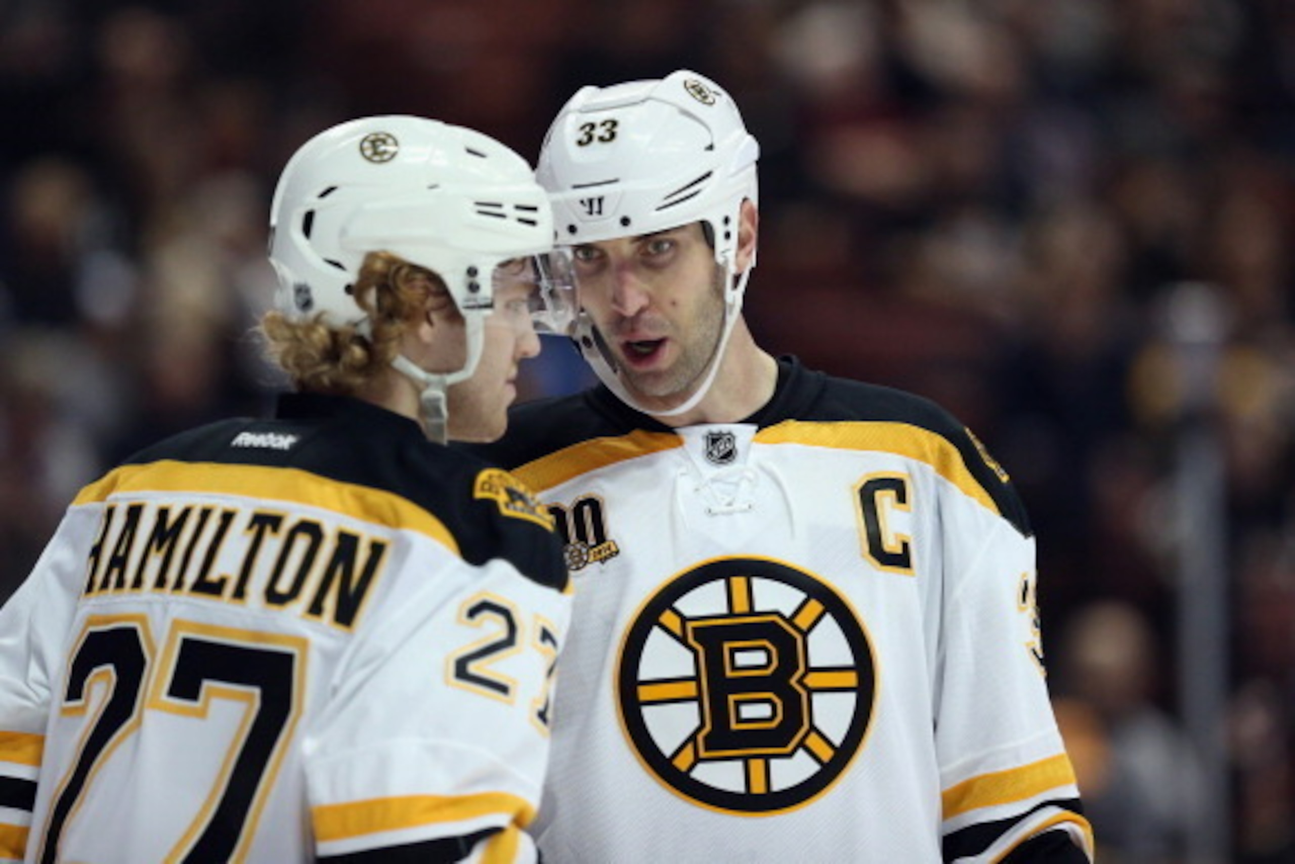 ANAHEIM, CA - JANUARY 07:  Dougie Hamilton #27 and Zdeno Chara #33 of the Boston Bruins talk against the Anaheim Ducks at Honda Center on January 7, 2014 in Anaheim, California.  (Photo by Jeff Gross/Getty Images)