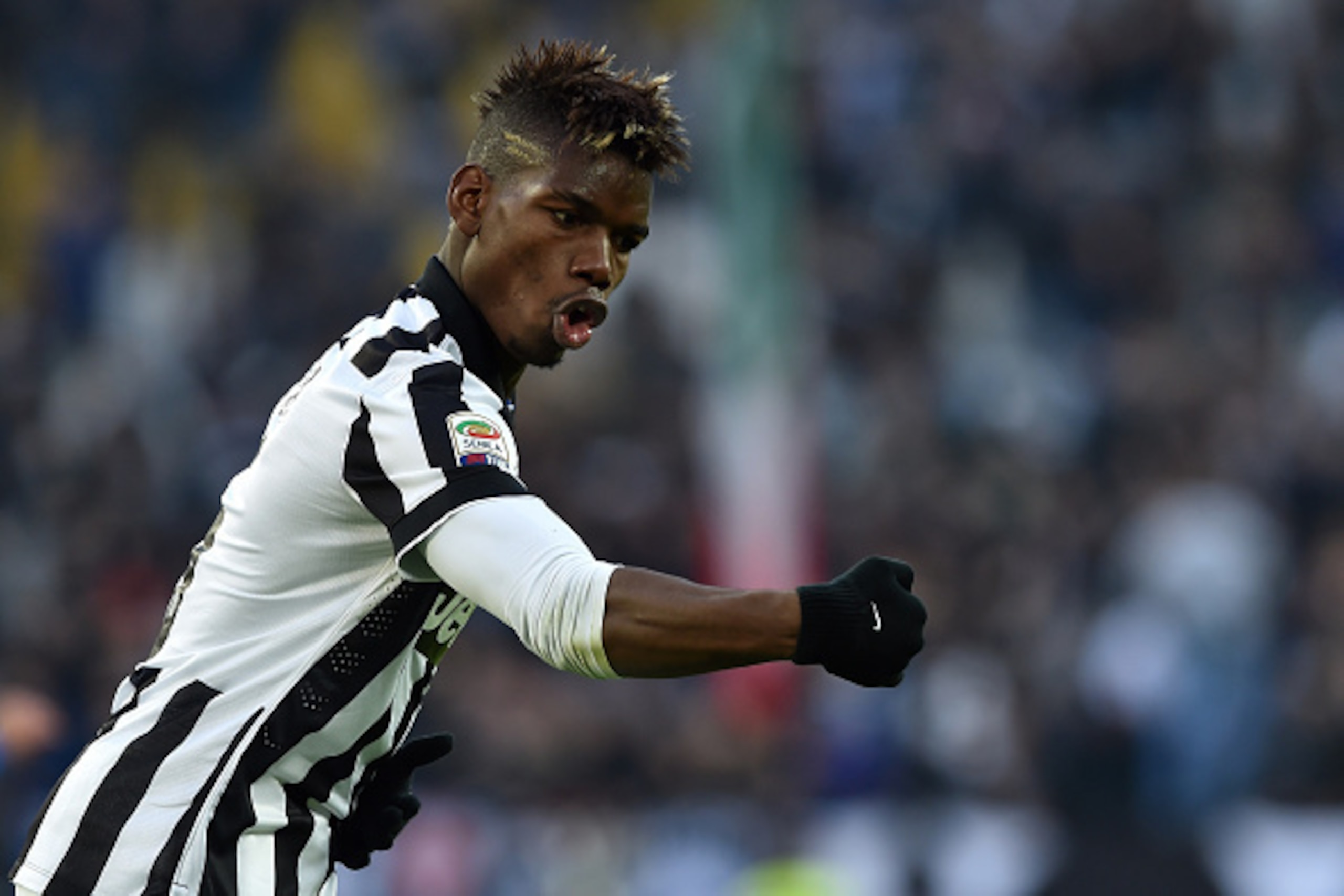 TURIN, ITALY - JANUARY 25:  Paul Pogba of Juventus FC celebrates after scoring the opening goal during the Serie A match between Juventus FC and AC Chievo Verona at Juventus Arena on January 25, 2015 in Turin, Italy.  (Photo by Valerio Pennicino/Getty Ima