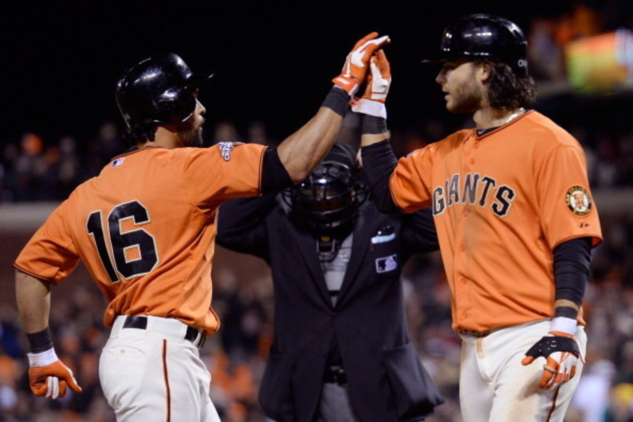 SAN FRANCISCO, CA - MAY 10:  Angel Pagan #16 of the San Francisco Giants is congratulated by Brandon Crawford #35 after Pagan hit a two-run homer against the Atlanta Braves in the six inning at AT&T Park on May 10, 2013 in San Francisco, California. Crawf