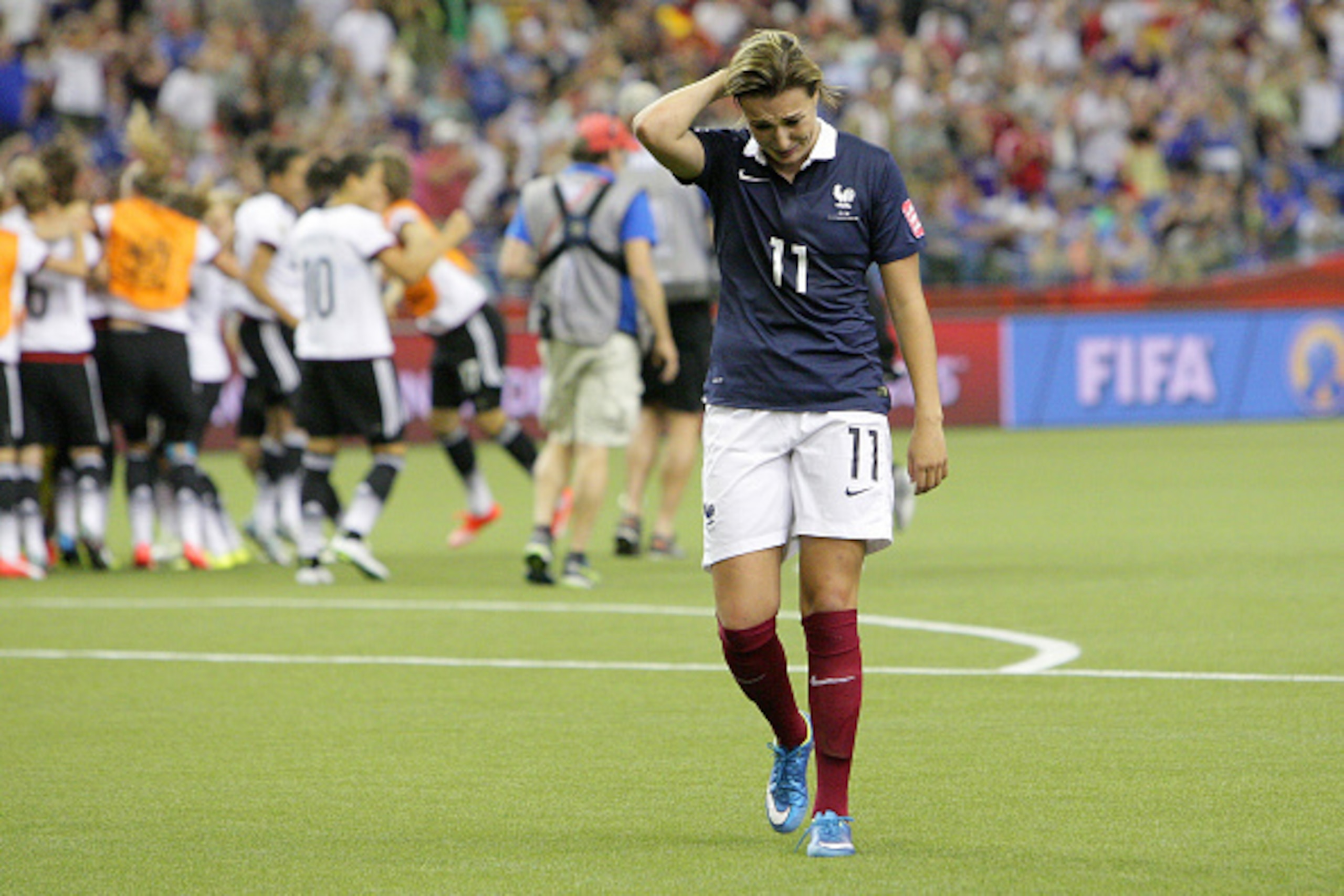 MONTREAL, QC - JUNE 27: Claire Lavogez #11 looks down after giving away the win to team Germany during the FIFA Women's World Cup Canada 2015 quarter final match between Germany and France at Olympic Stadium on June 27, 2015 in Montreal, Canada.  (Photo b