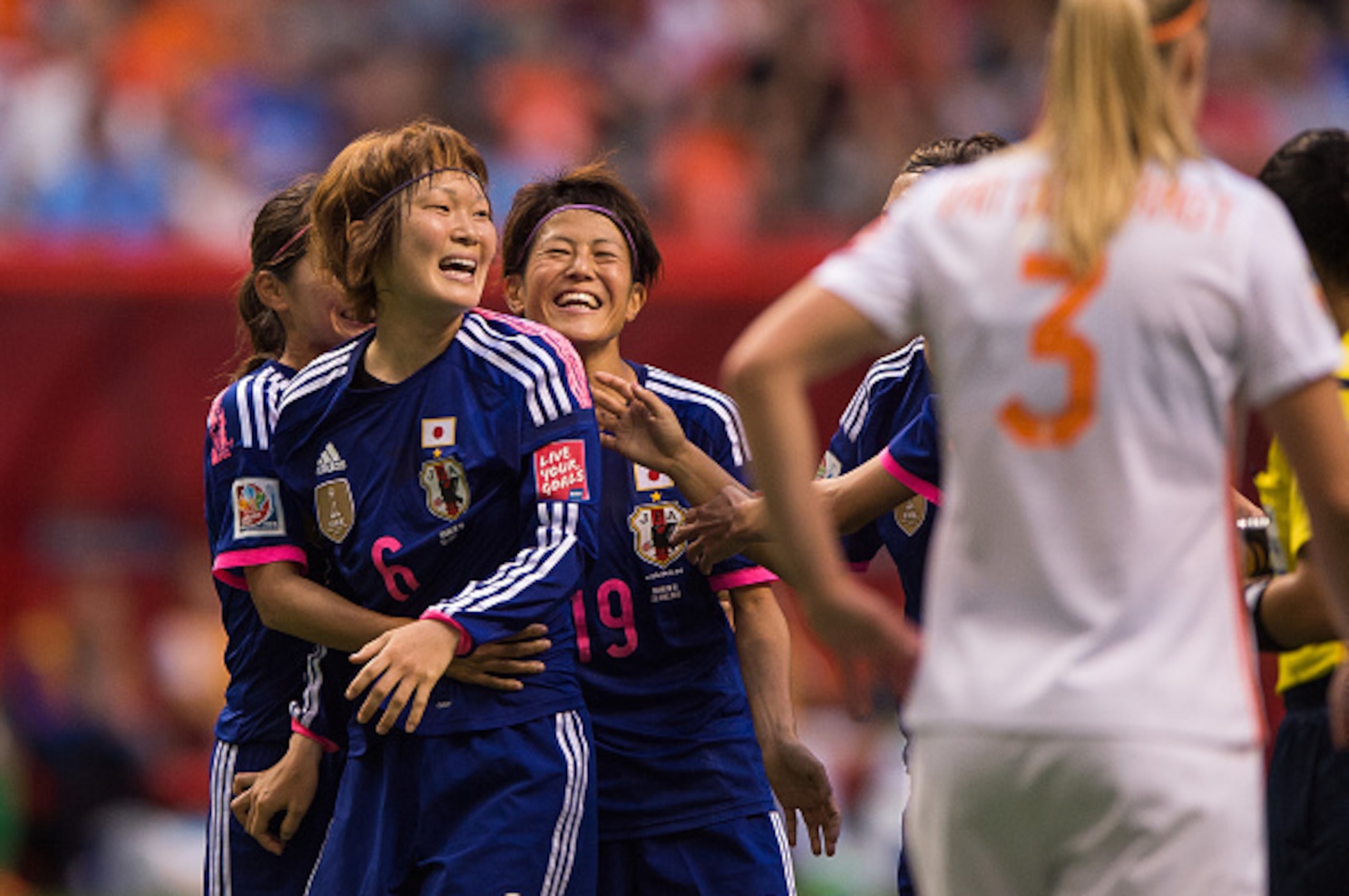 VANCOUVER, BC - JUNE 23: Mizuho Sakaguchi #6 of Japan is congratulated by teammates Nahomi Kawasumi #9 and Saori Ariyoshi #19 after scoring on the Netherlands during the FIFA Women's World Cup Canada 2015 Round of 16 match between the Netherlands and Japa VANCOUVER, BC - JUNE 23: Mizuho Sakaguchi #6 of Japan is congratulated by teammates Nahomi Kawasumi #9 and Saori Ariyoshi #19 after scoring on the Netherlands during the FIFA Women's World Cup Canada 2015 Round of 16 match between the Netherlands and Japa