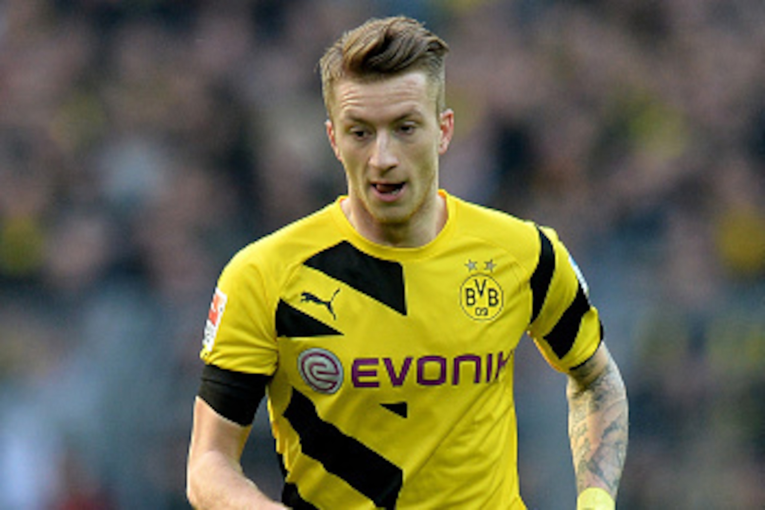 DORTMUND, GERMANY - APRIL 04:  Marco Reus of Dortmund runs with the ball during the Bundesliga match between Borussia Dortmund and FC Bayern Muenchen at Signal Iduna Park on April 4, 2015 in Dortmund, Germany.  (Photo by Sascha Steinbach/Getty Images For 