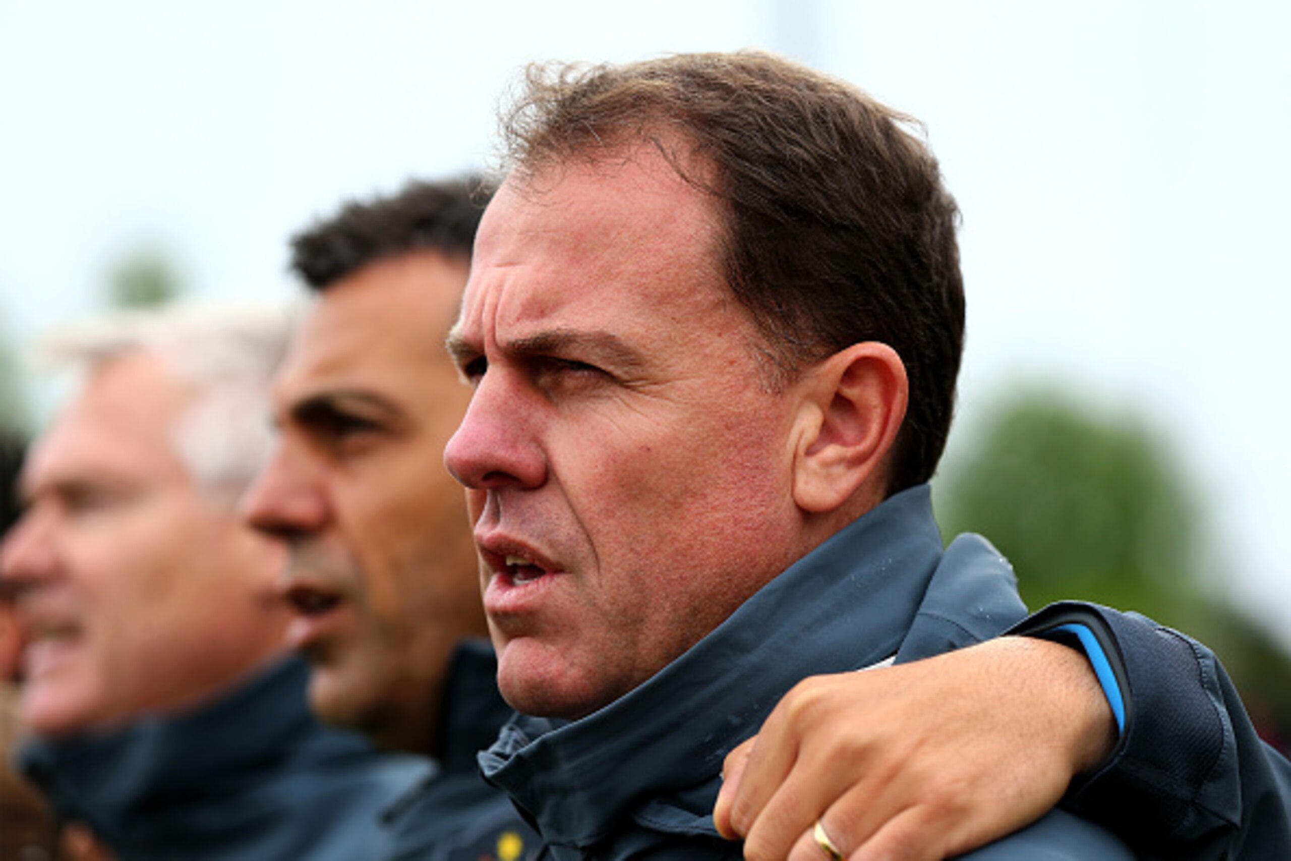 MONCTON, NB - JUNE 21:  Head coach Alen Stajcic of Australia stands for the Australian national anthem before the match against Brazil during the FIFA Women's World Cup 2015 round of 16 match between Brazil and Australia at Moncton Stadium on June 21, 201