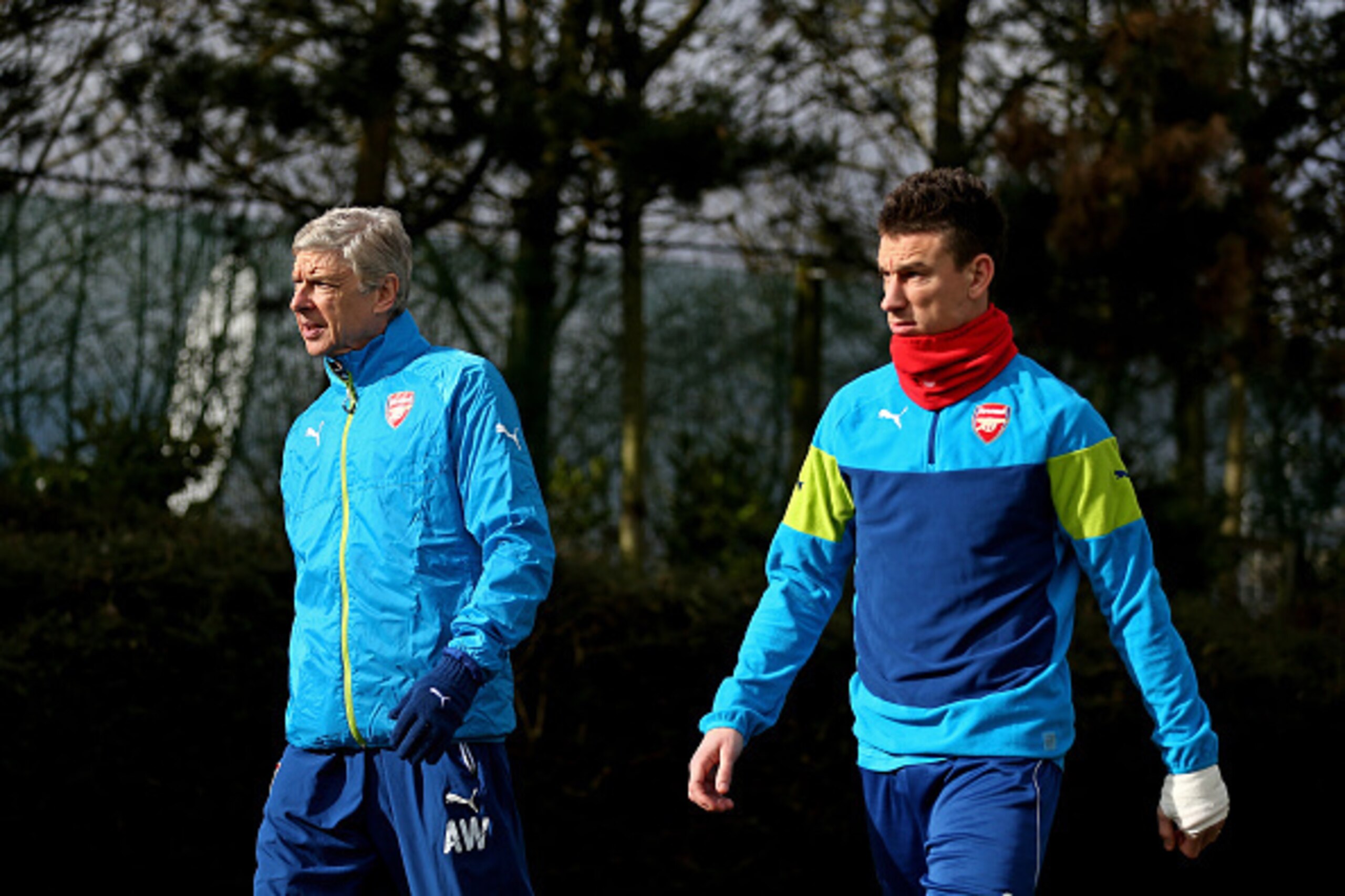ST ALBANS, ENGLAND - FEBRUARY 24: Arsene Wenger the manager of Arsenal and Laurent Koscielny of Arsenal arrive for the Arsenal training session ahead of the UEFA Champions League round of 16 match against AS Monaco at London Colney on February 24, 2015 i ST ALBANS, ENGLAND - FEBRUARY 24: Arsene Wenger the manager of Arsenal and Laurent Koscielny of Arsenal arrive for the Arsenal training session ahead of the UEFA Champions League round of 16 match against AS Monaco at London Colney on February 24, 2015 i