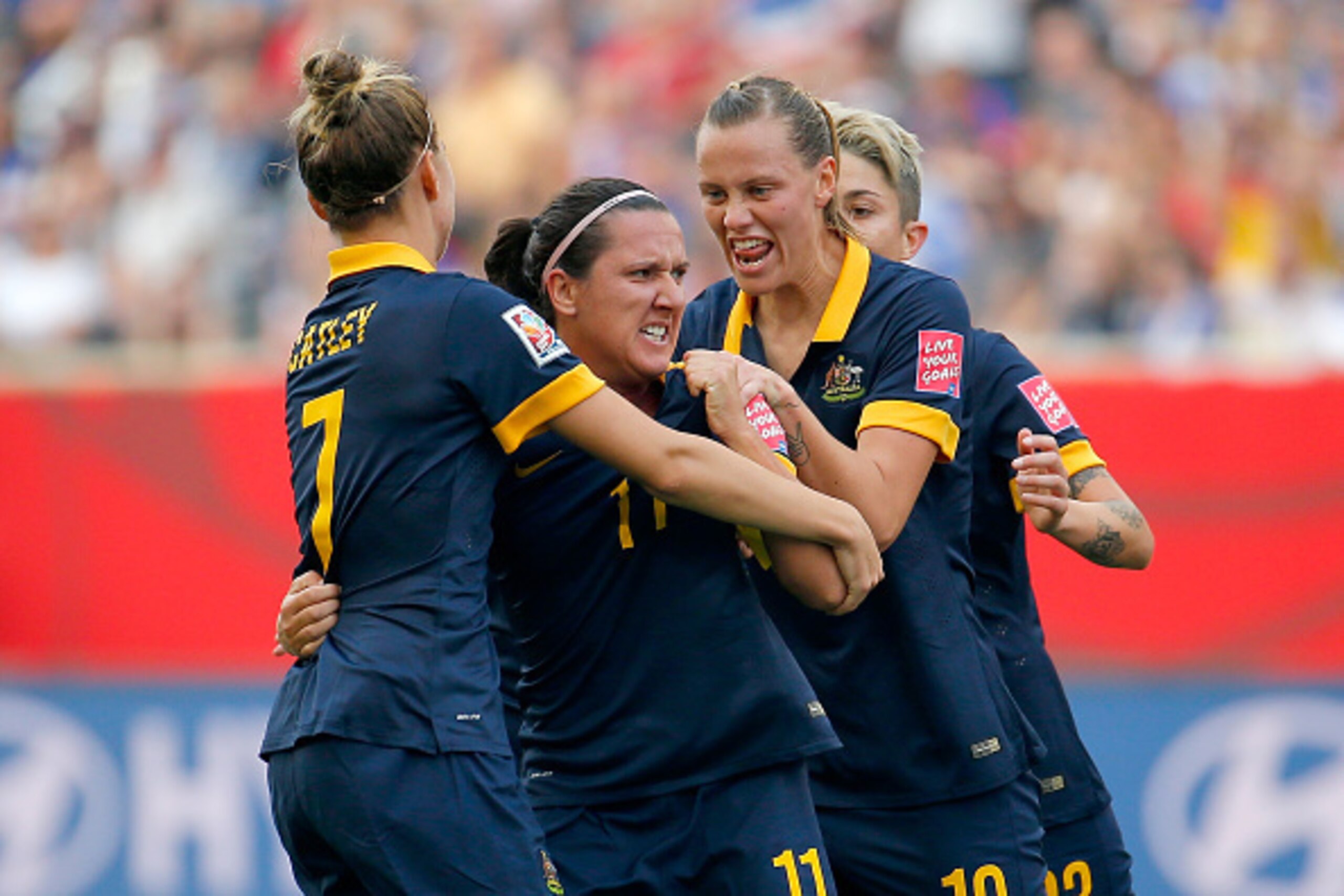 WINNIPEG, MB - JUNE 08:  Lisa De Vanna #11 of Australia celebrates her first half goal with teammates against the United States during the FIFA Women's World Cup 2015 Group D match at Winnipeg Stadium on June 8, 2015 in Winnipeg, Canada.  (Photo by Kevin 