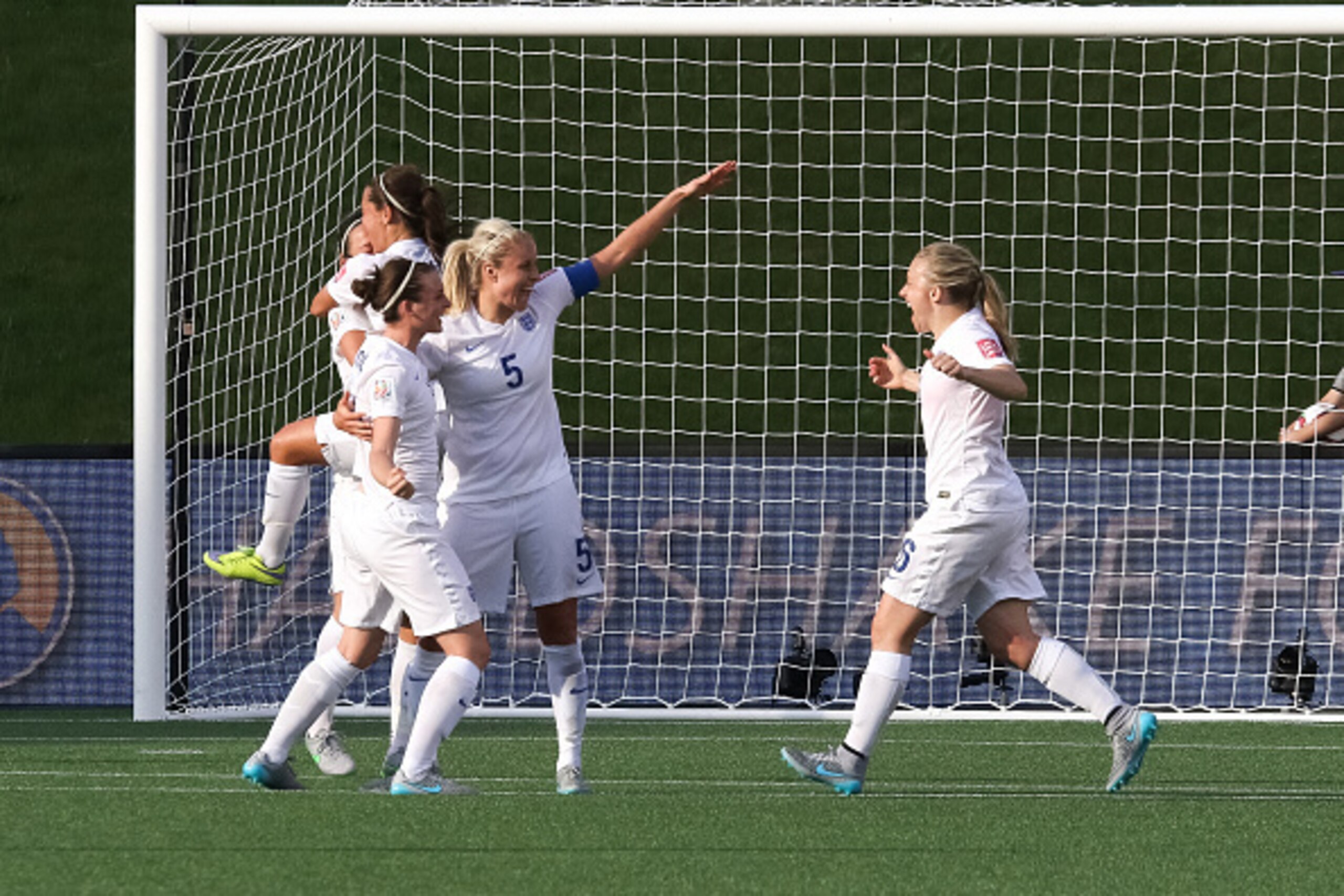 OTTAWA, ON - JUNE 22: Jade Moore #11, Steph Houghton #5 and Laura Bassett #6 of England celebrate their win after the FIFA Women's World Cup Canada 2015 round of 16 match between Norway and England at Lansdowne Stadium on June 22, 2015 in Ottawa, Canada. 