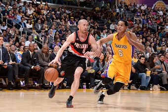 LOS ANGELES, CA - APRIL 3:  Steve Blake #5 of the Portland Trail Blazers handles the ball against Jordan Clarkson #6 of the Los Angeles Lakers on April 3, 2015 at STAPLES Center in Los Angeles, California. NOTE TO USER: User expressly acknowledges and agr