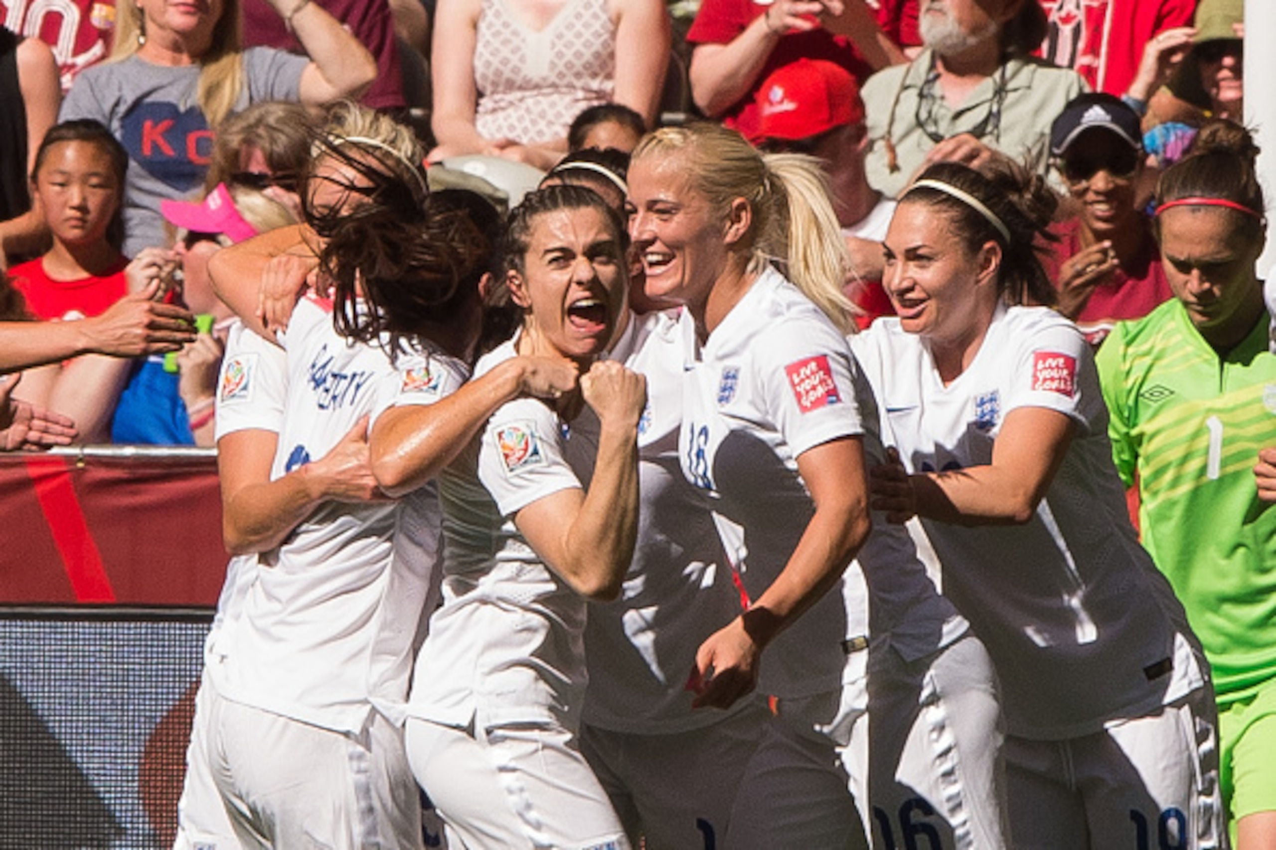 VANCOUVER, BC - JUNE 27: Claire Rafferty #3 of England celebrates team mate Lucy Bronze's #12 (not pictured) goal against Canada walks during the FIFA Women's World Cup Canada 2015 Quarter Final match between the England and Canada June, 27, 2015 at BC Pl