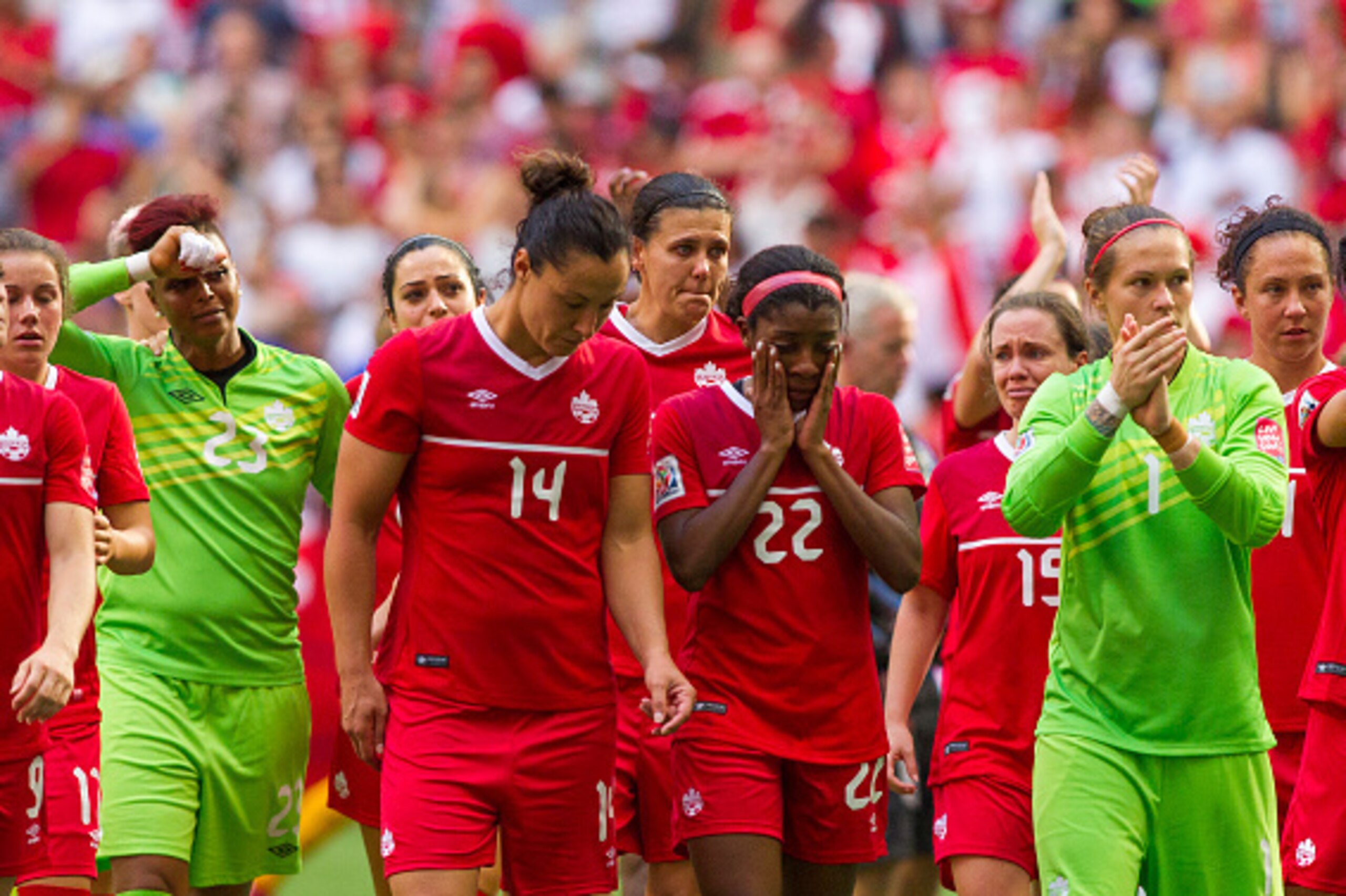 VANCOUVER, BC - JUNE 27: Christine Sinclair #12 of Canada is pictured with teammates after losing to England during the FIFA Women's World Cup Canada 2015 Quarter Final match between England and Canada June 27, 2015 at BC Place Stadium in Vancouver, Briti