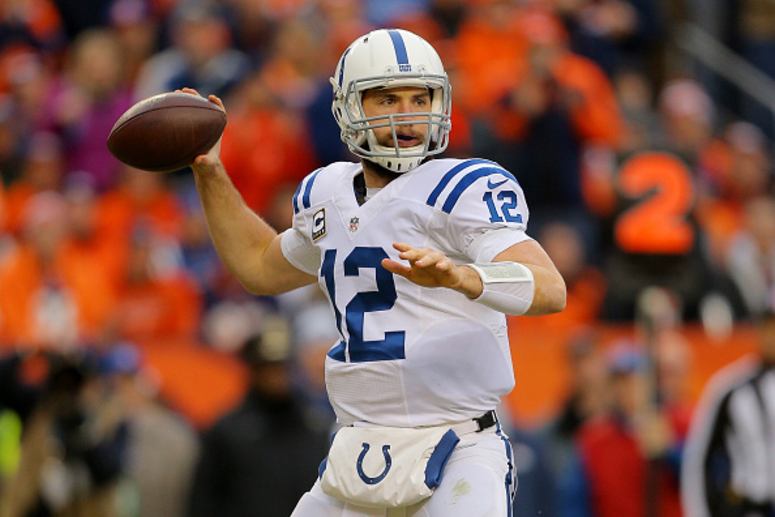 DENVER, CO - JANUARY 11:  Andrew Luck #12 of the Indianapolis Colts passes against the Denver Broncos during a 2015 AFC Divisional Playoff game at Sports Authority Field at Mile High on January 11, 2015 in Denver, Colorado.  (Photo by Justin Edmonds/Getty