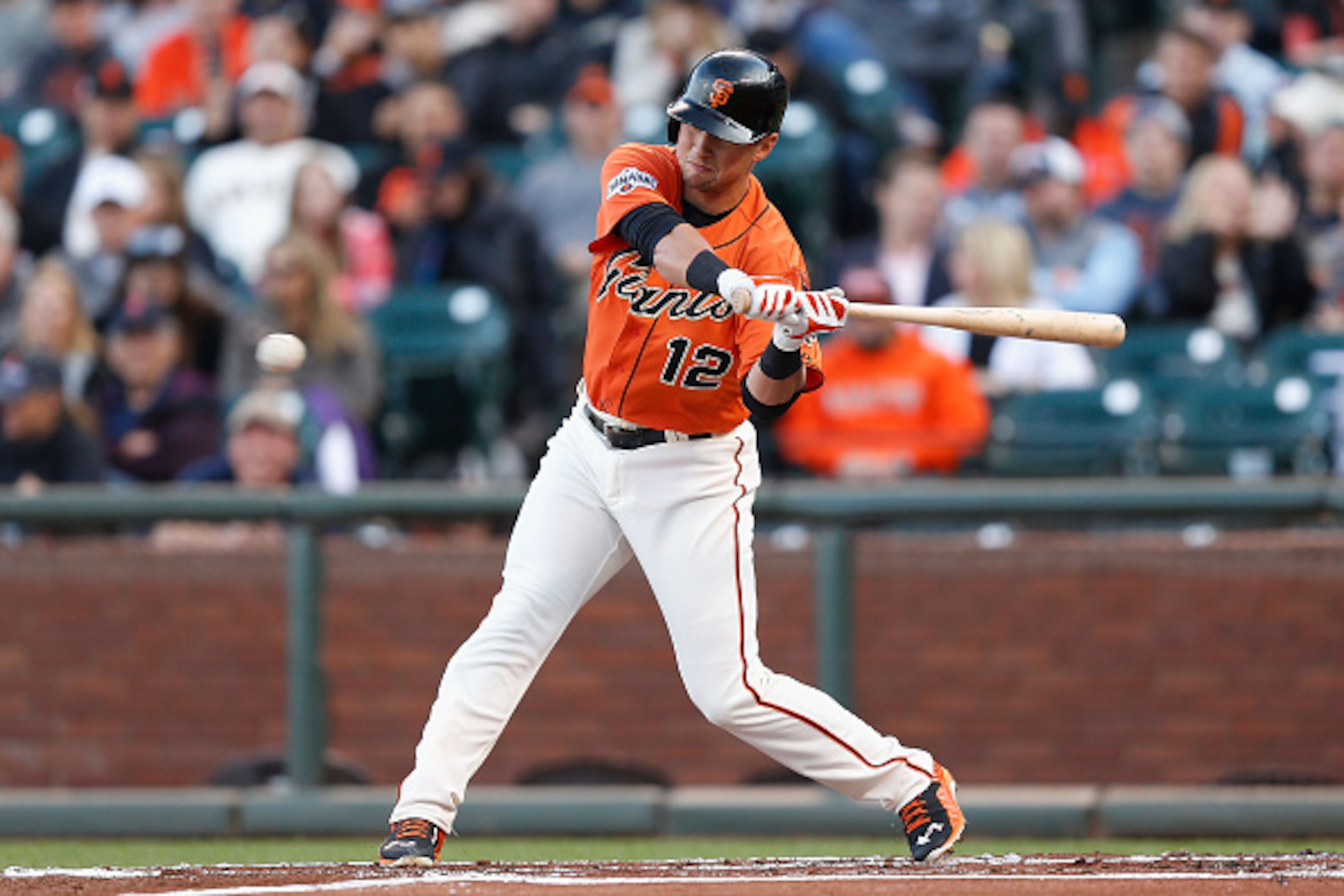 SAN FRANCISCO, CA - JUNE 26:  Joe Panik #12 of the San Francisco Giants hits a double in the first inning against the Colorado Rockies at AT&T Park on June 26, 2015 in San Francisco, California.  (Photo by Lachlan Cunningham/Getty Images)